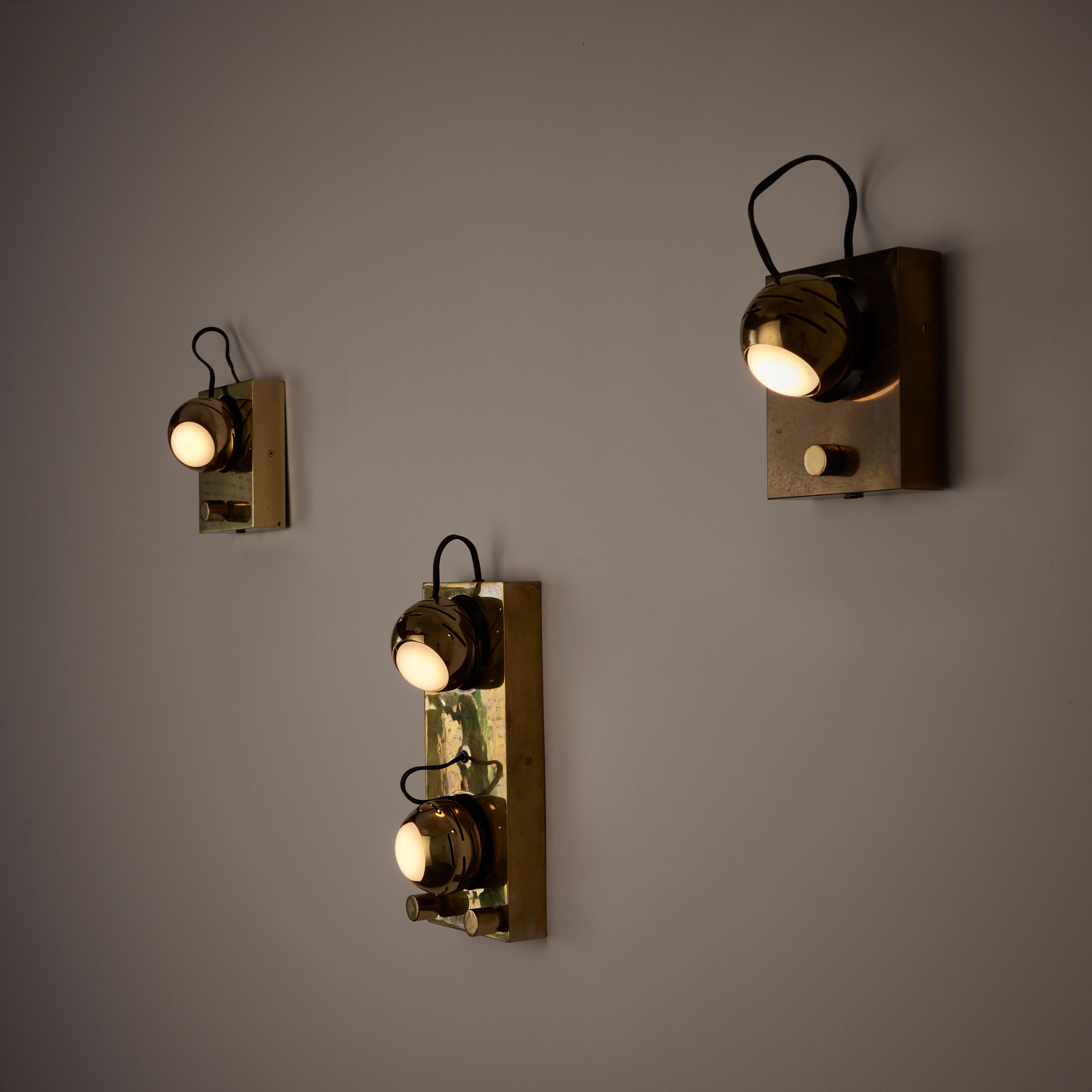 Eyeball Sconces by Angelo Lelli for Arredoluce. Designed and manufactured in Italy, circa 1960. Brass sconces with fully anatomical bulb sockets. We recommend using a 40w maximum R14 medium base LED Light Bulb. Rewired for US standards. Bulb