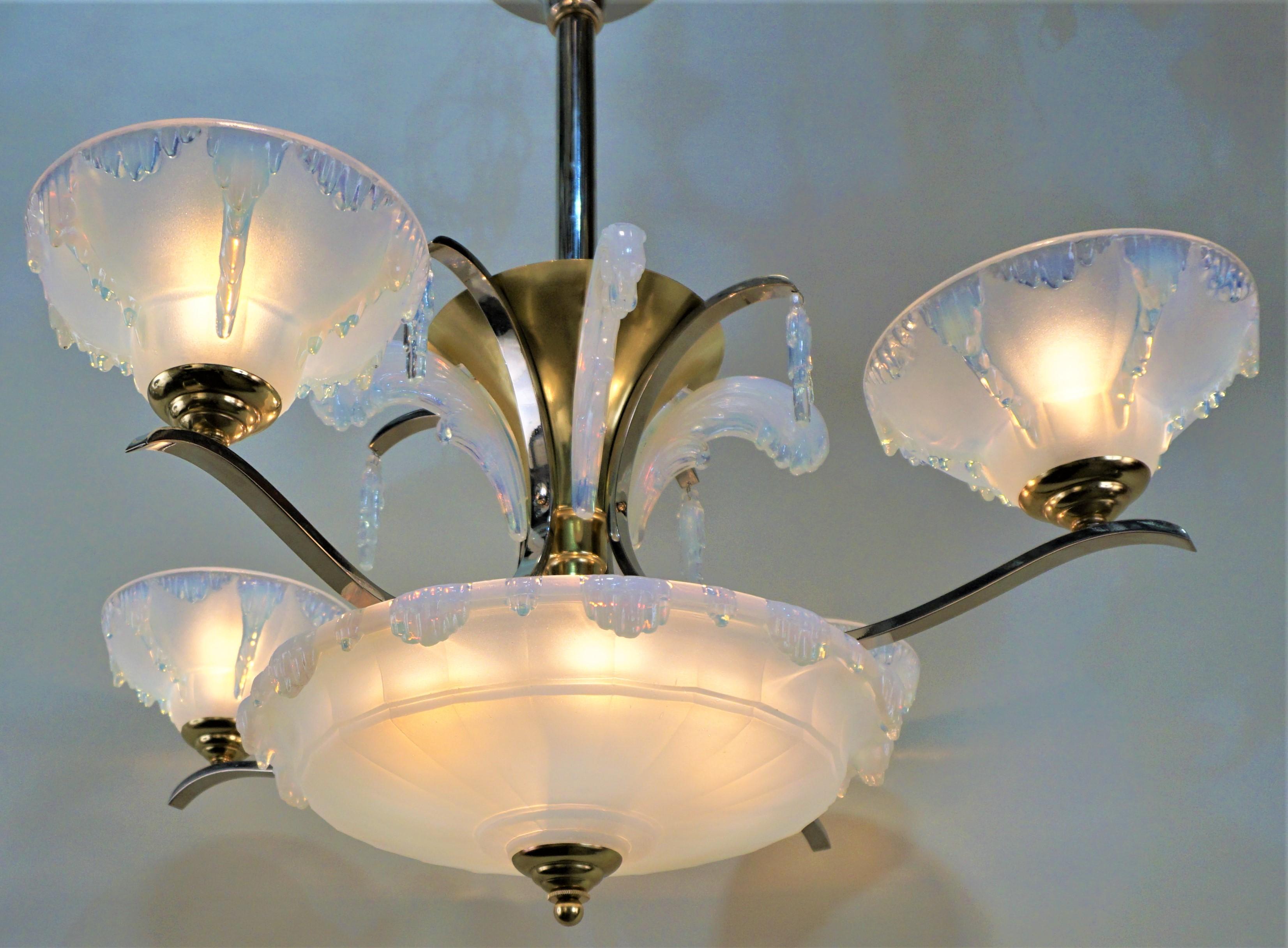 Bronze and nickel Art Deco four arm, five beautiful opalescent glass lampshades by Ezan. This 1930s chandelier has total of ten lights with 60 watt max each.