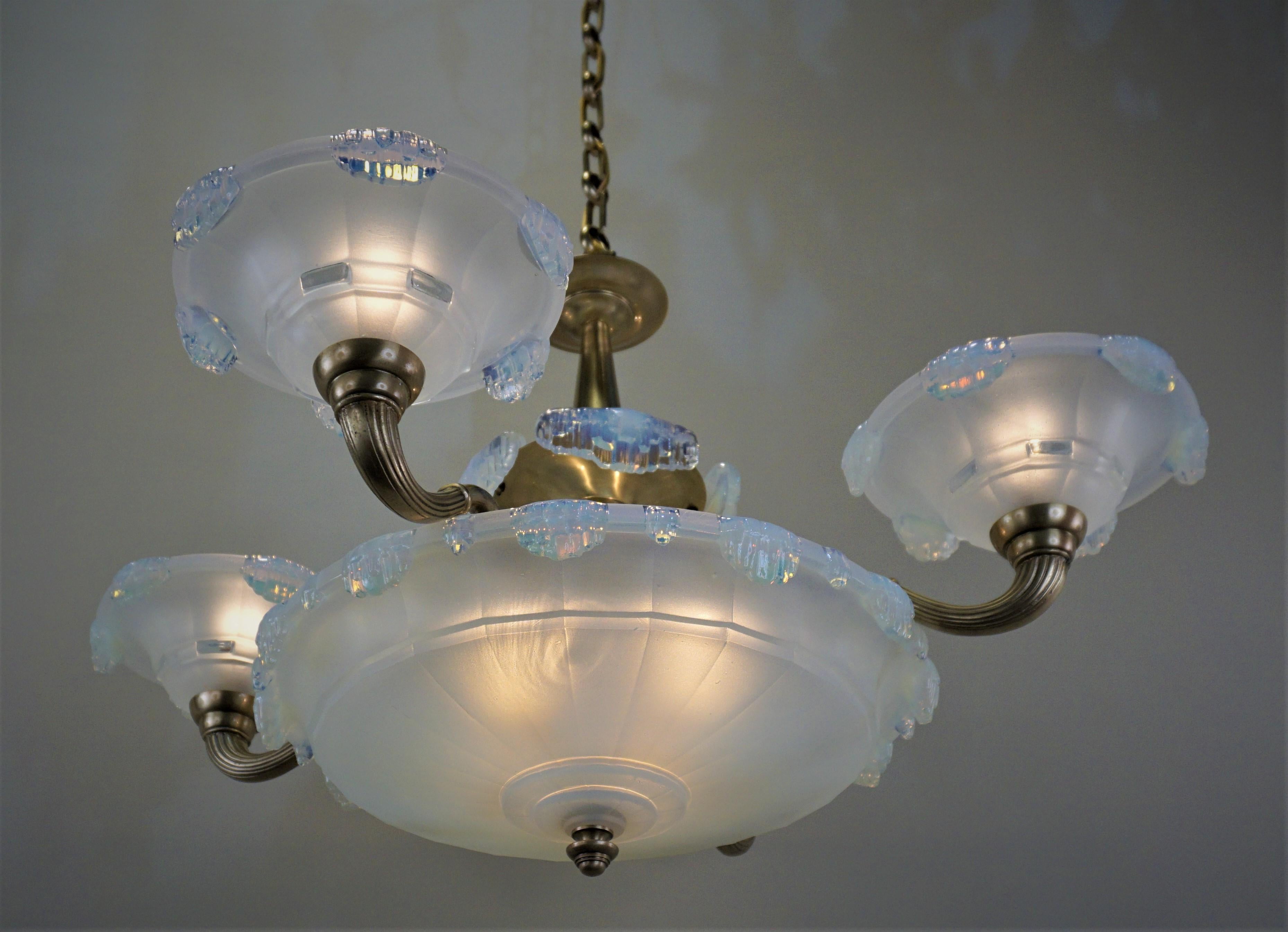 Bronze Art Deco four arm, five beautiful opalescent glass lampshades by Ezan, This 1930s chandelier has total of eight with 60 watt max each.