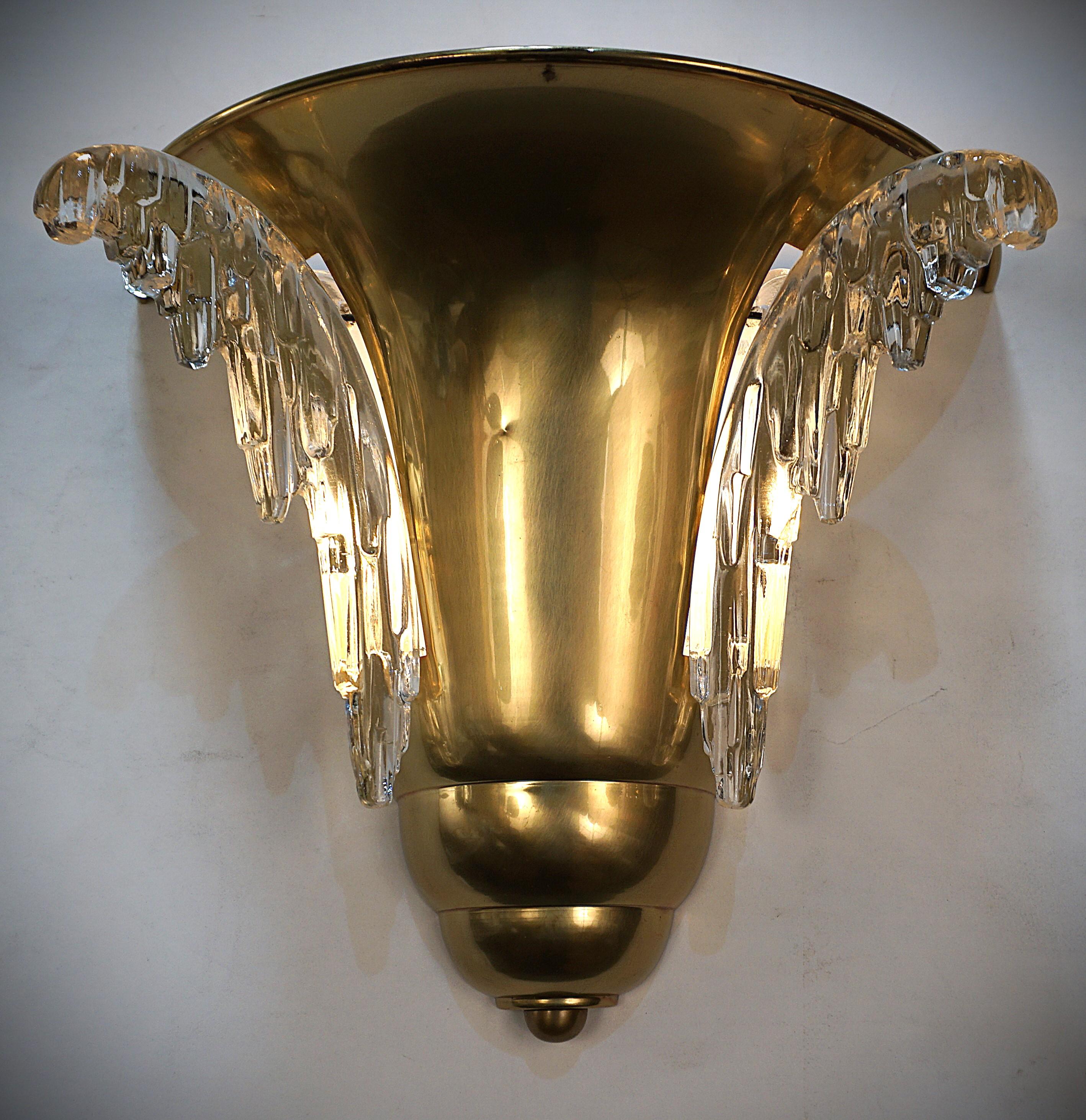 1930's clear glass and bronze wall sconces by Petitot and Ezan .