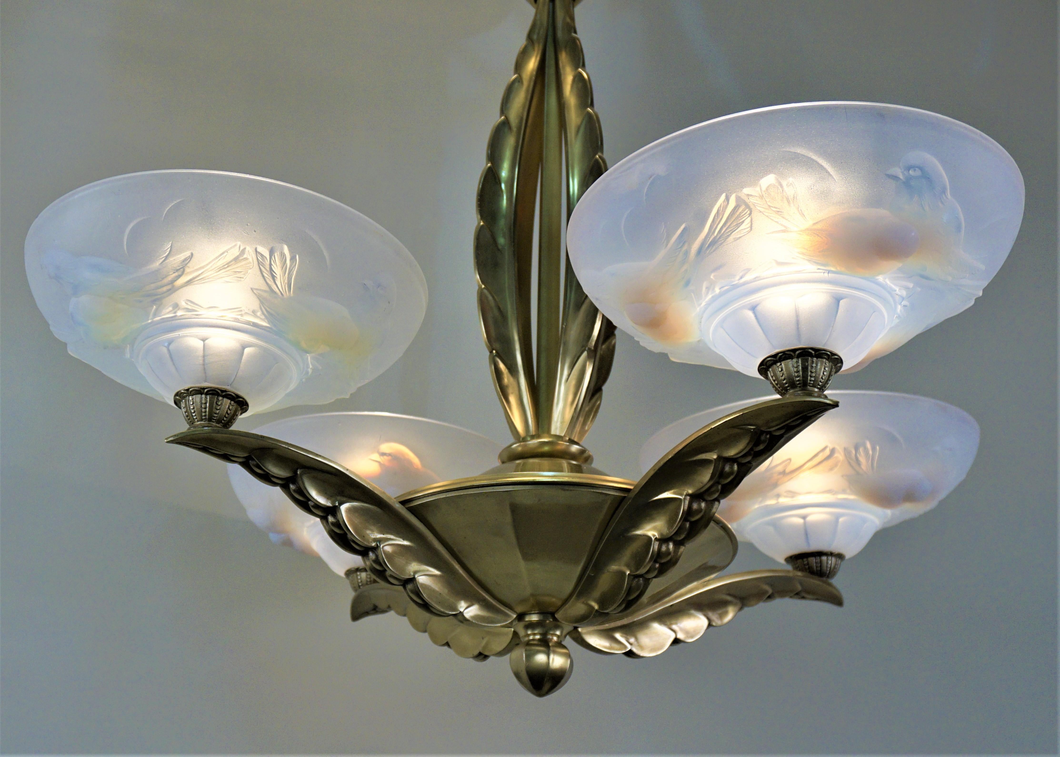 Opalescent glass with bronze frame chandelier by Ezan and Petitot. 
Height can be reduced by removing some of the chain.