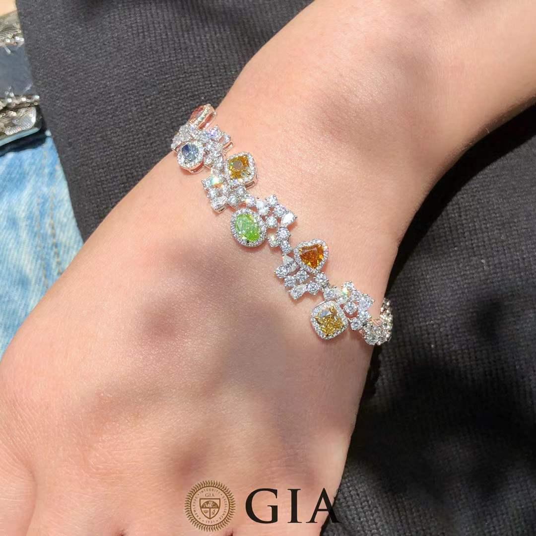 GIA Certified 5.40 Carat Natural Colored Diamond Bracelet in 18K White Gold

A rare and radiant statement piece, this made-to-order bracelet features 10 GIA-certified natural colored diamonds, totaling 5.40 carats, set in luxurious 18K white gold.
