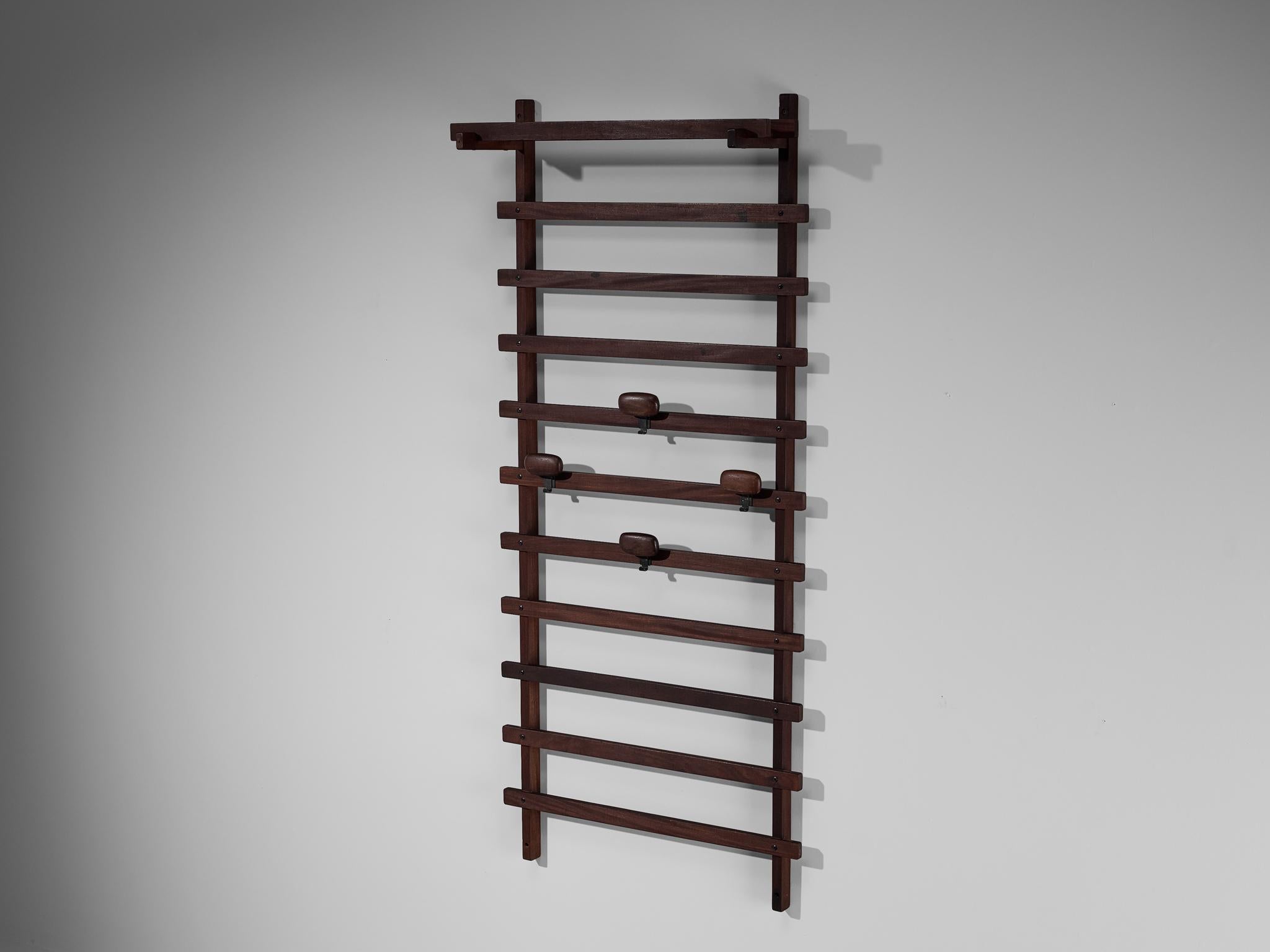 Ezhio Longhi for Elam, wall or coat rack, teak, Italy, 1961.

This hallway setting is executed in solid teak. The set features soft lines and has a warm appearance due to the the warm and dark colour of the stained and patinated teak. The set is