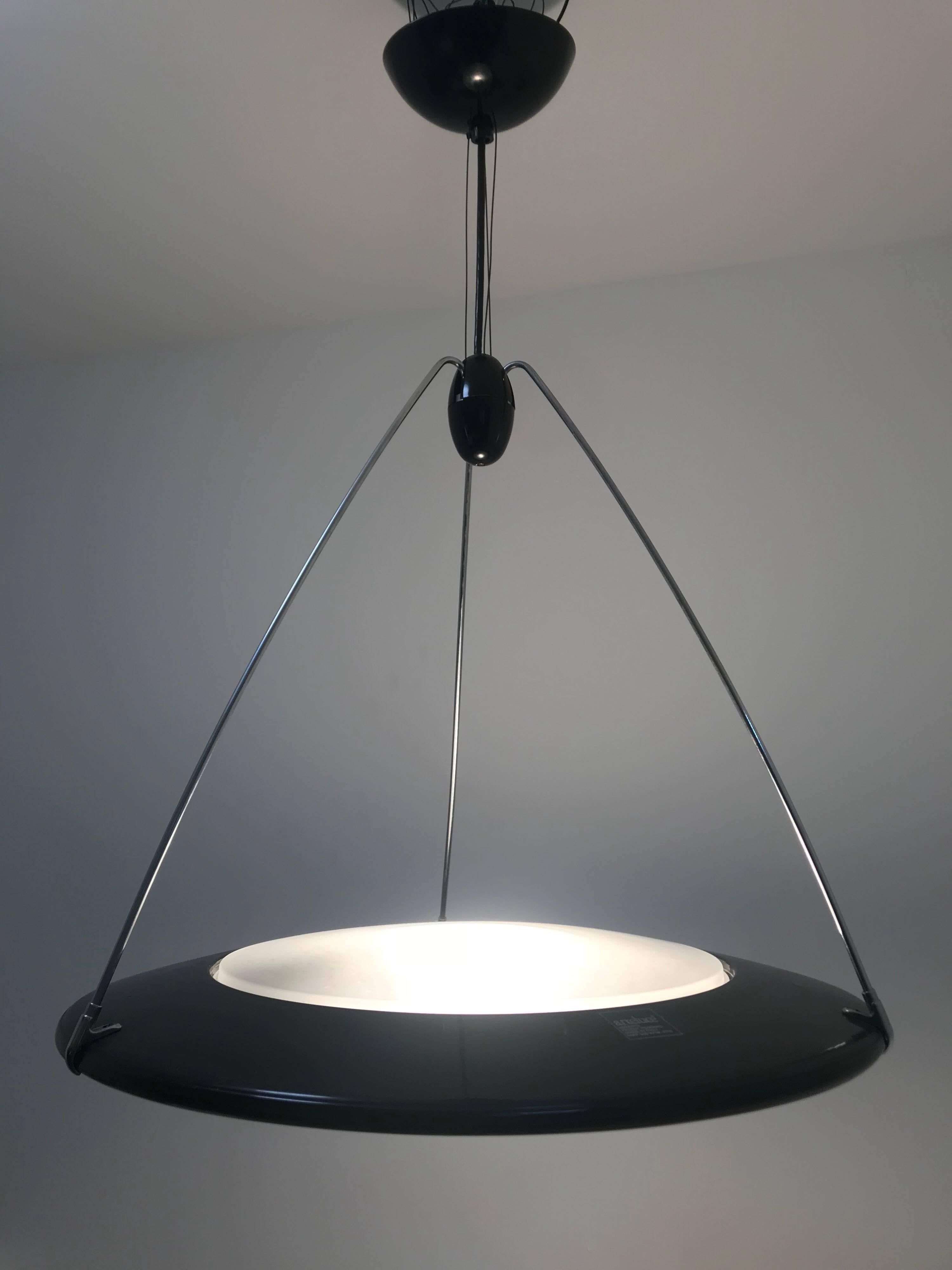 Postmodern UFO or flying saucer pendant light designed by Ezio Didone for Arteluce.