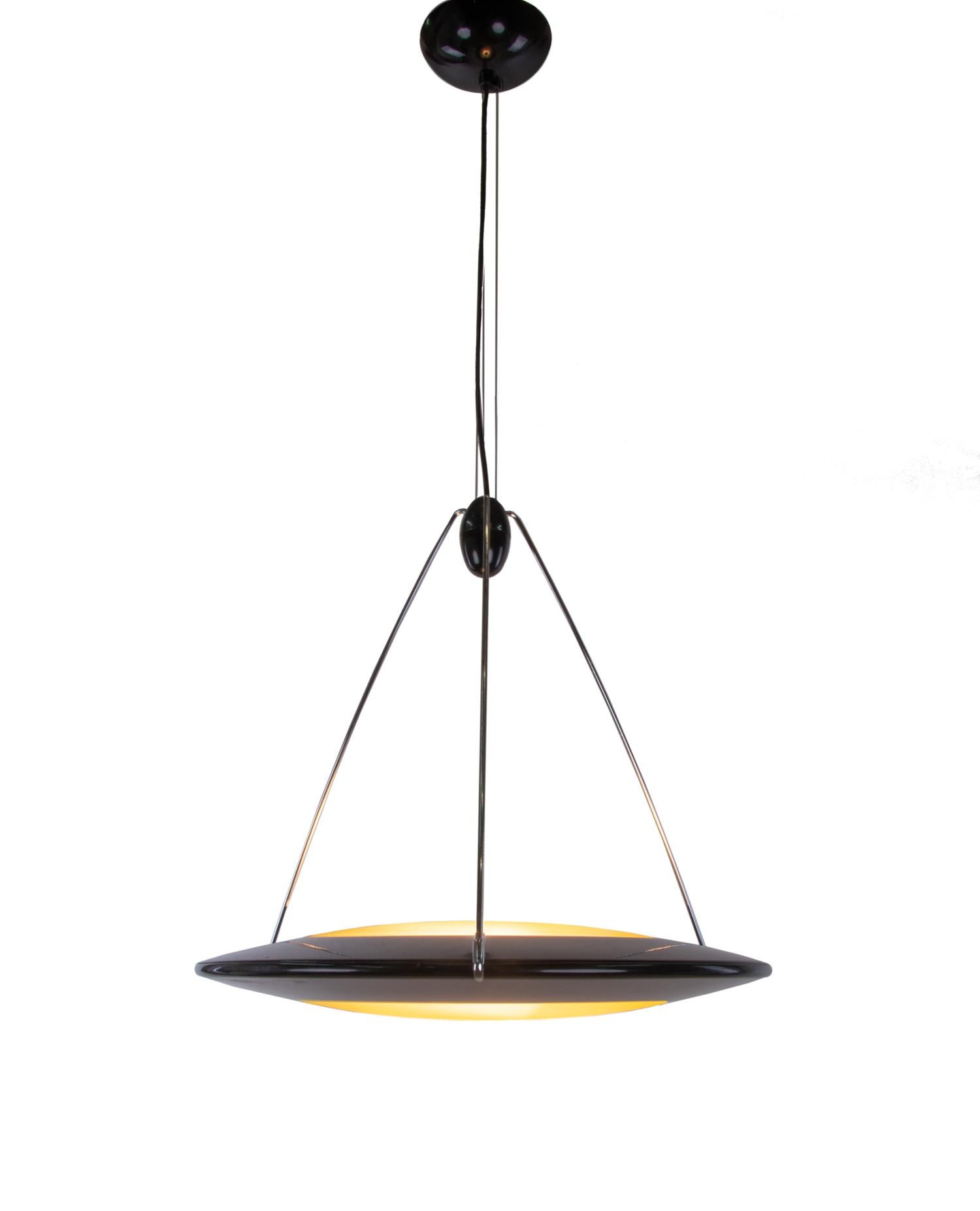 Postmodern UFO or flying saucer pendant light giving diffused upward and downward light.
Designed in the 1990s by Ezio Didone and manufactured by Arteluce (in those years division of FLOS.), Milano, Italy. 
A real eye-catcher even unlit. Gem from