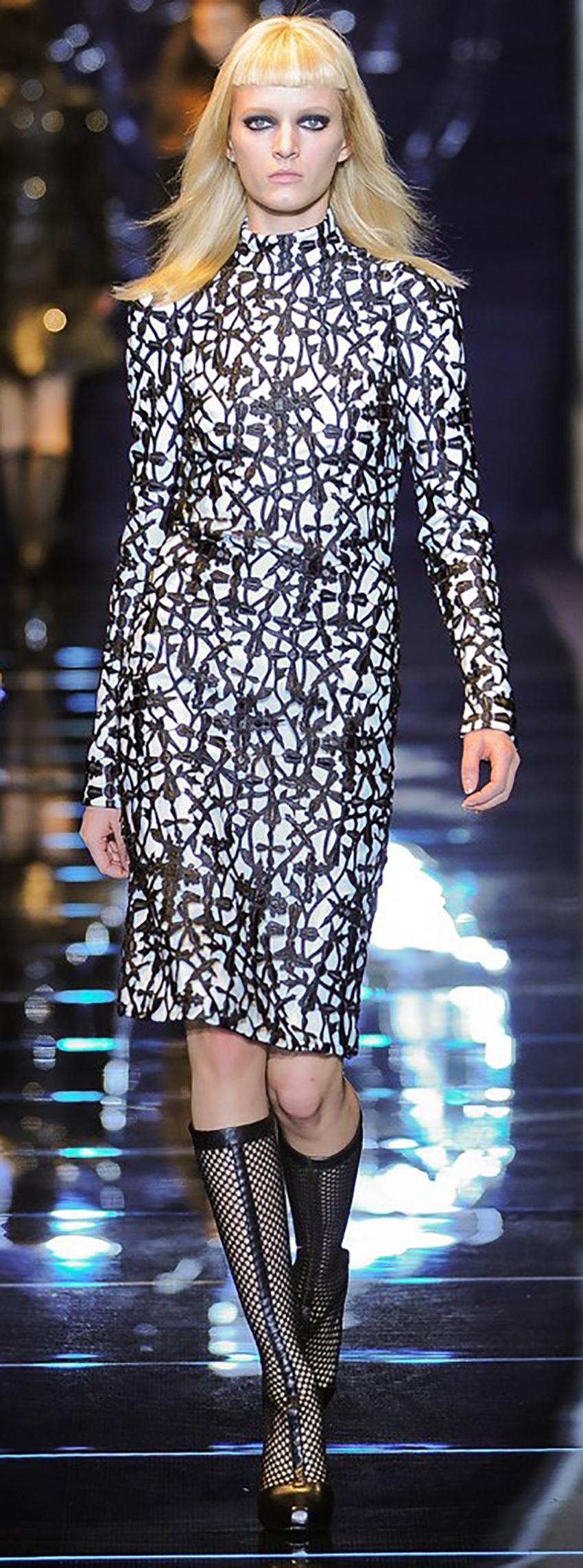 VERSACE 

Actual Runway Samole Fall/Winter 2012 Look # 6 

Macrame Gothic Cross Cocktail Dress 

This long sleeve, turtle neck cocktail dress features an allover macrame Gothic cross overlay.

Back center zip 


Content:100% polyester 
lining: 100%