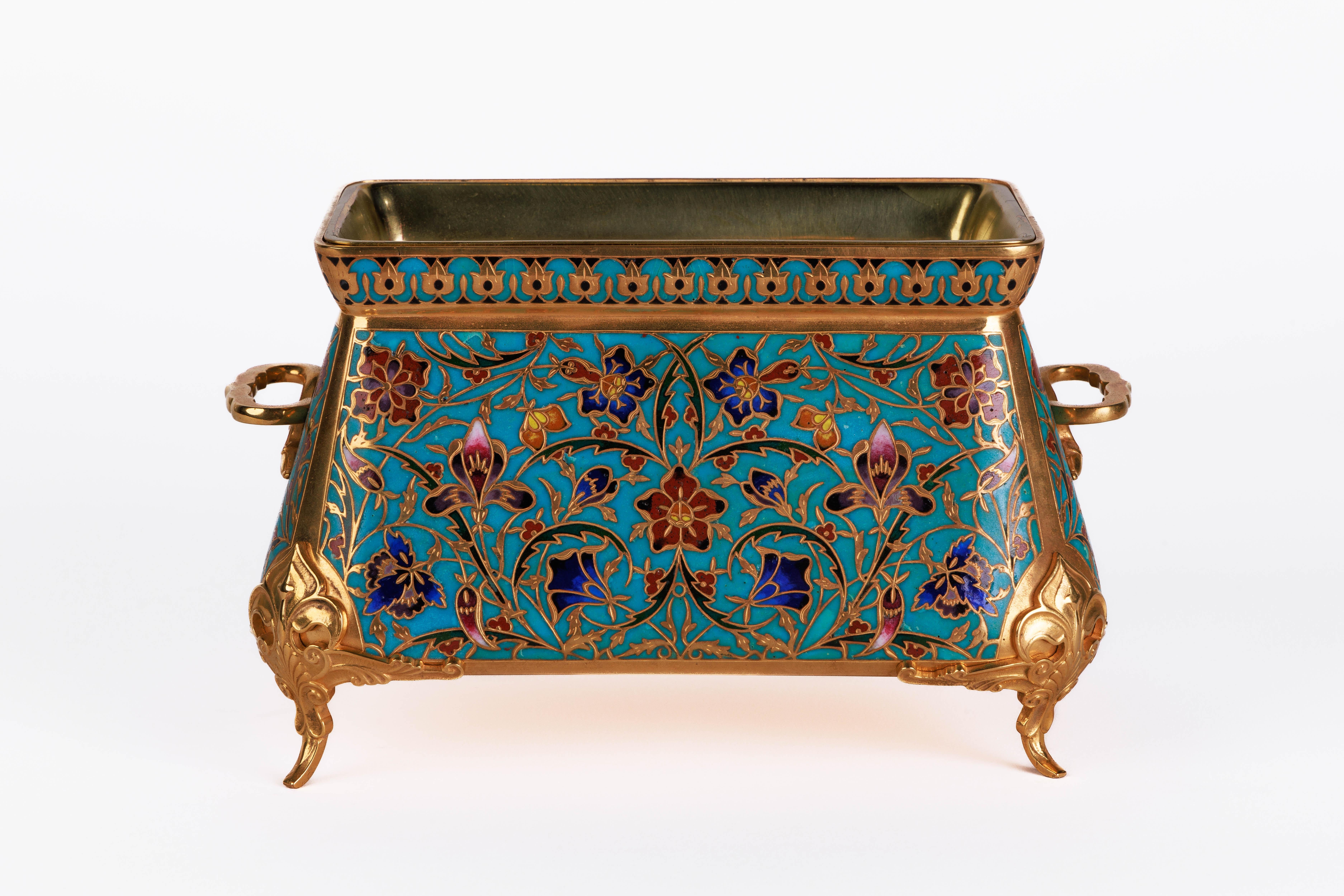 Ferdinand Barbedienne, An Exquisite Suite of Three French Ormolu and Champleve Enamel Jardinieres / Garniture C. 1870, The Design Attributed to Louis Constant Sevin.

Comprising of three exceptional quality turquoise and yellow-ground champlevé