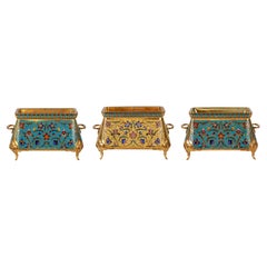 F. Barbedienne, une suite de trois jardinières françaises en bronze doré et émail champlevé