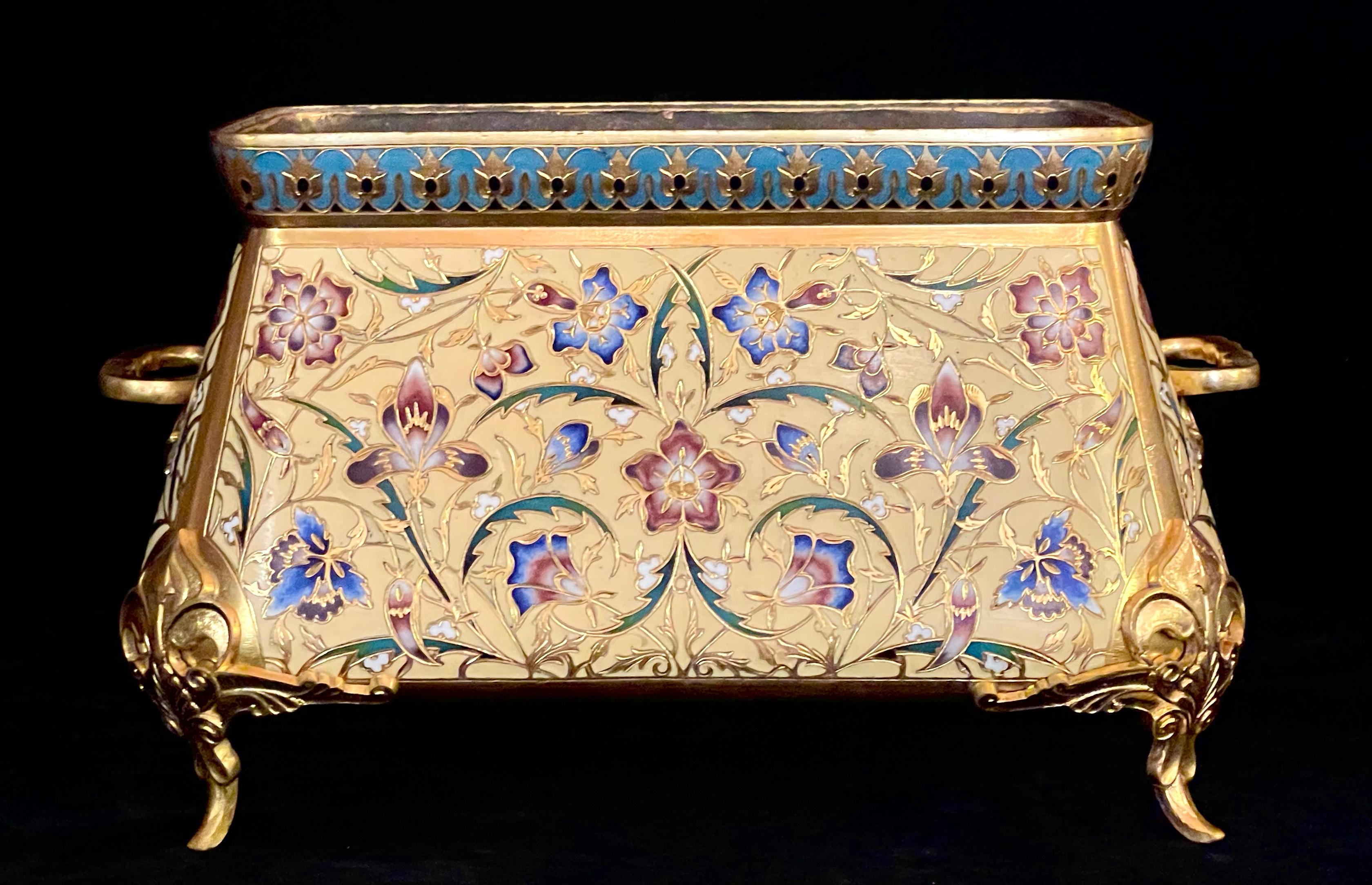 A high quality and richly detailed French 19th century ormolu and champlevé enamel jardinière, signed by the renowned bronzier F. Barbedienne and attributed to the celebrated designer Louis-Constant Sévin. This striking jardinière is boldly formed