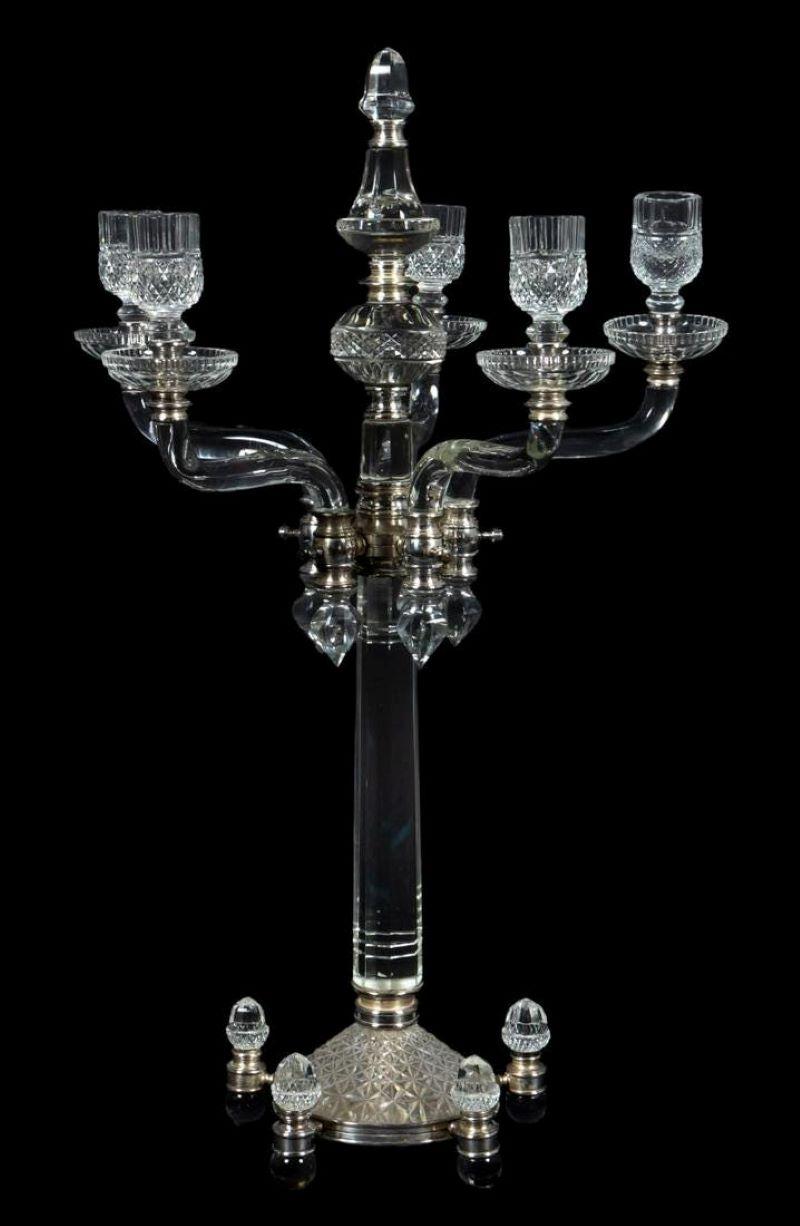 F. & C. Osler (English, founded 1807). Large silver plate mounted crystal five arm candelabrum supported by five crystal ball feet. Metal parts numbered. 
England, Circa 1880. Dimensions: H. 24.75