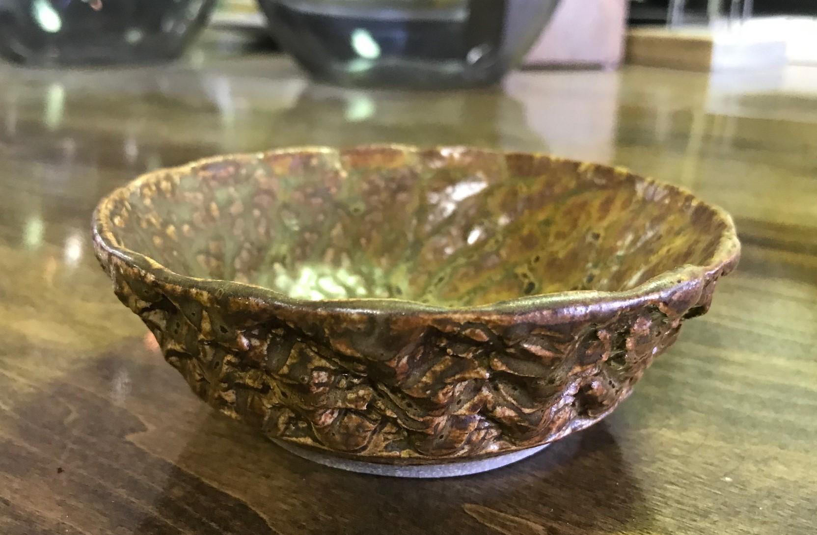 A fantastic, wonderfully glazed Mid-Century Modern pottery bowl by renowned California master potter F. Carlton Ball.

Ball, who studied with Glen Lukens, taught at the University of Southern California between 1956-1967 and later at the