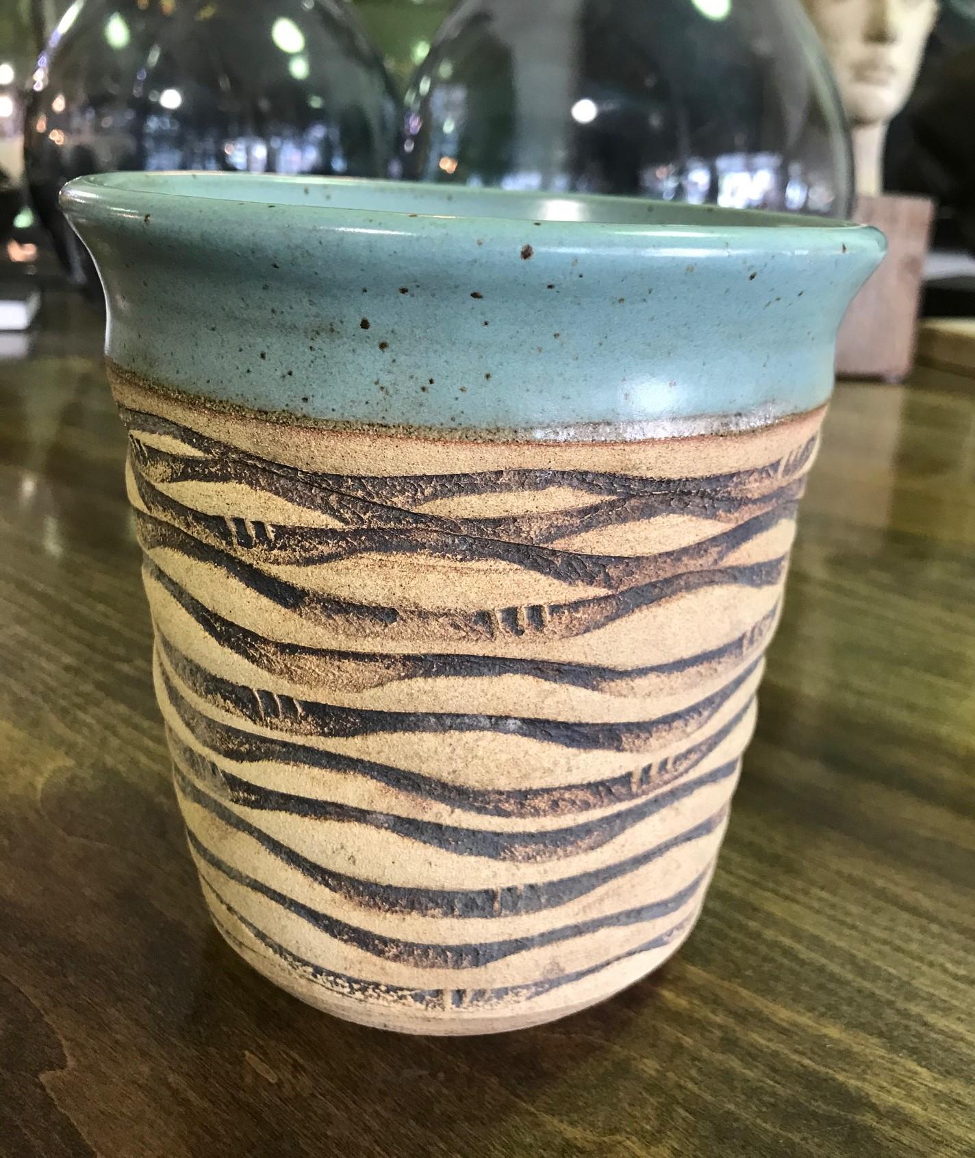 A gorgeous colored, wonderfully textured, midcentury pottery bowl or vase by renowned master potter F. Carlton Ball.

Ball, who studied with Glen Lukens, taught at University of Southern California between 1956-1967 and later at University of