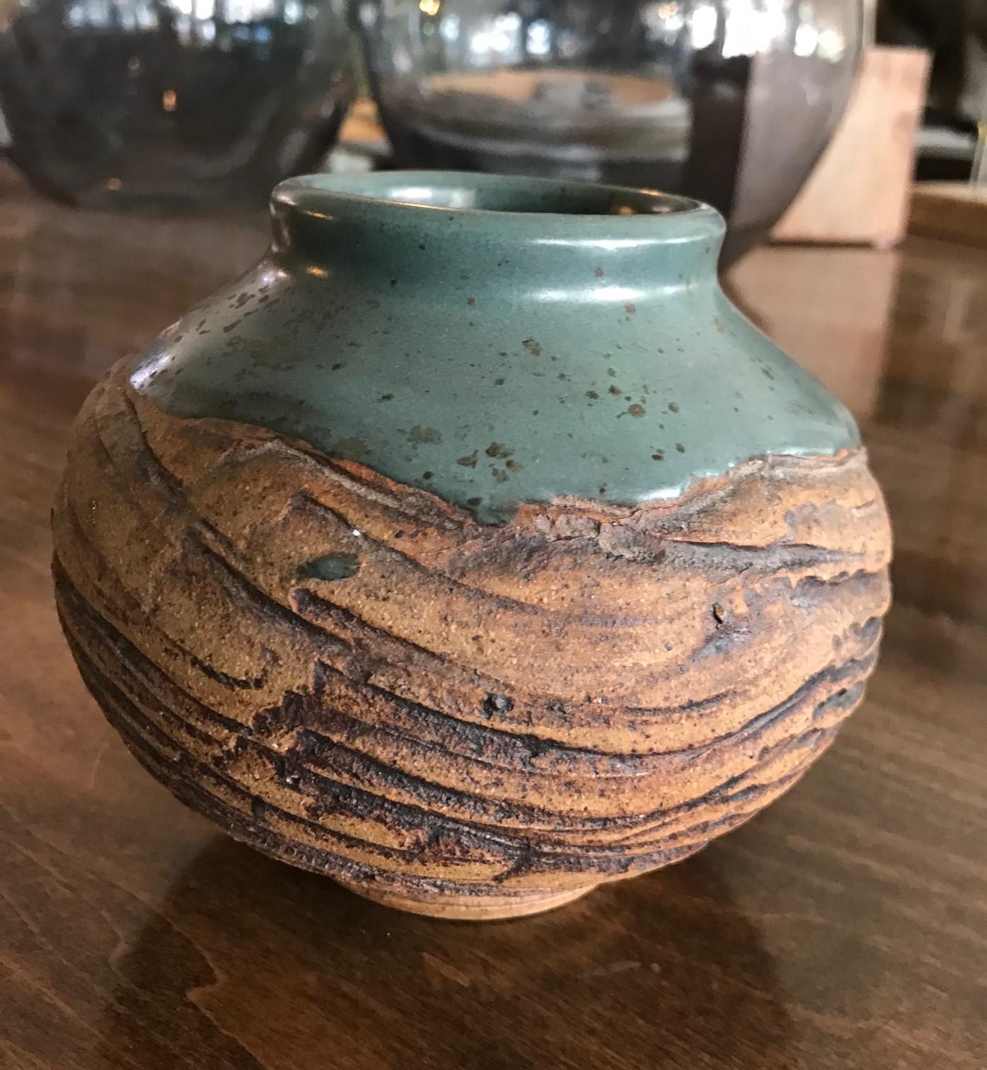 A gorgeous, midcentury pottery vase by renowned master potter F. Carlton Ball.

Ball, who studied with Glen Lukens, taught at University of Southern California between 1956-1967 and later at University of Puget Sound, Tacoma, Washington from