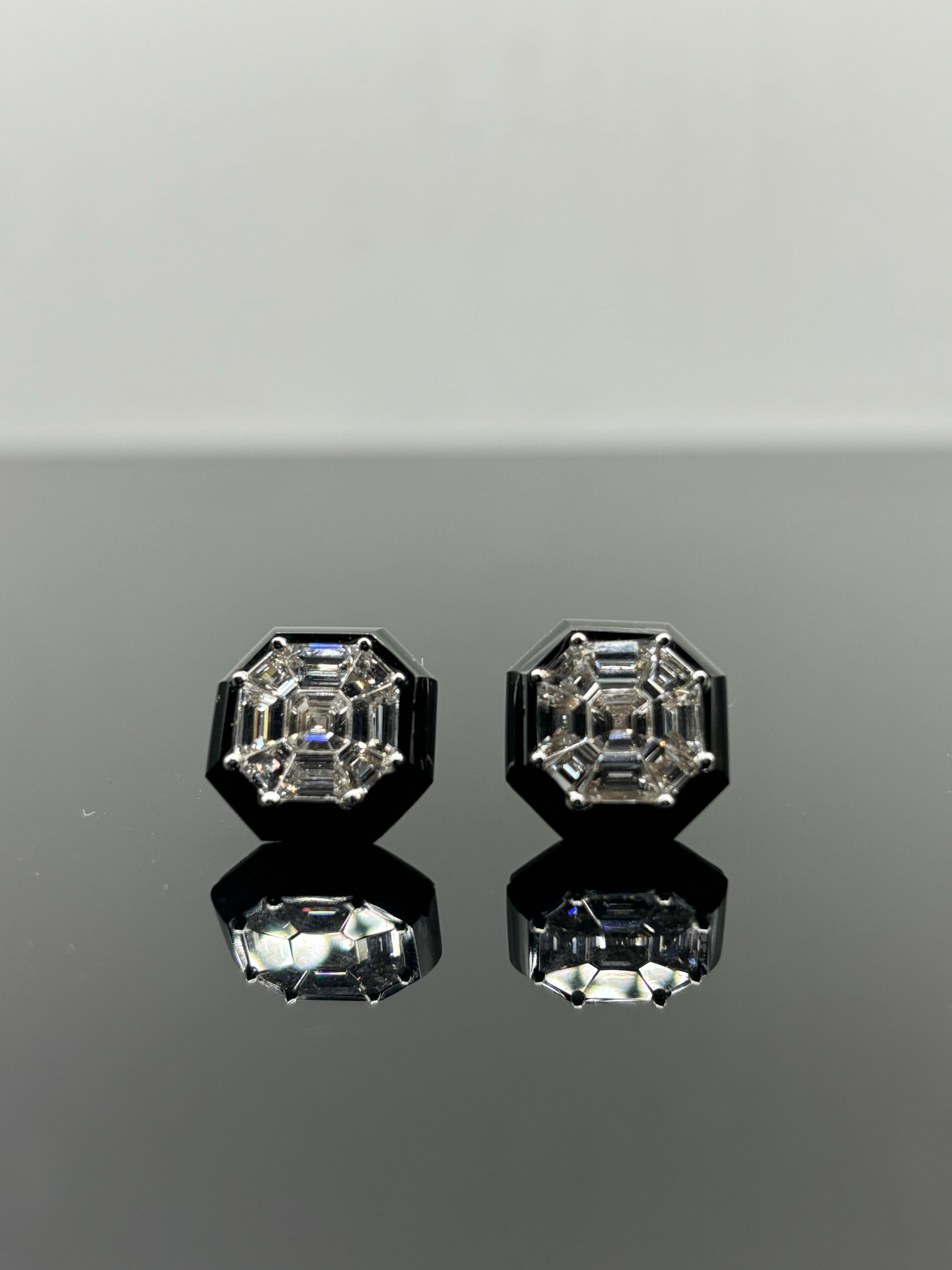 A beautiful pair of 2.88 carat cluster earrings, F/G color, VS/VVS quality. The  diamonds are enhanced by black onyx, giving it a modern look. We can customize the earrings, and remove the black onyx as well. All set in solid 18K White Gold. Comes