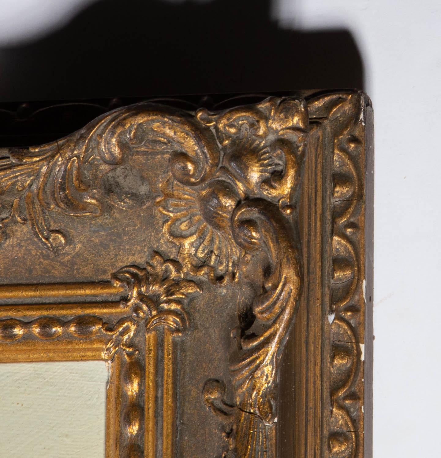 A verdant scene at a woodland pool surrounded by trees. Presented in an ornate gilt-effect frame with swept and pierced moulding at the corners and edges. Signed to the lower-right edge. On canvas on stretchers.