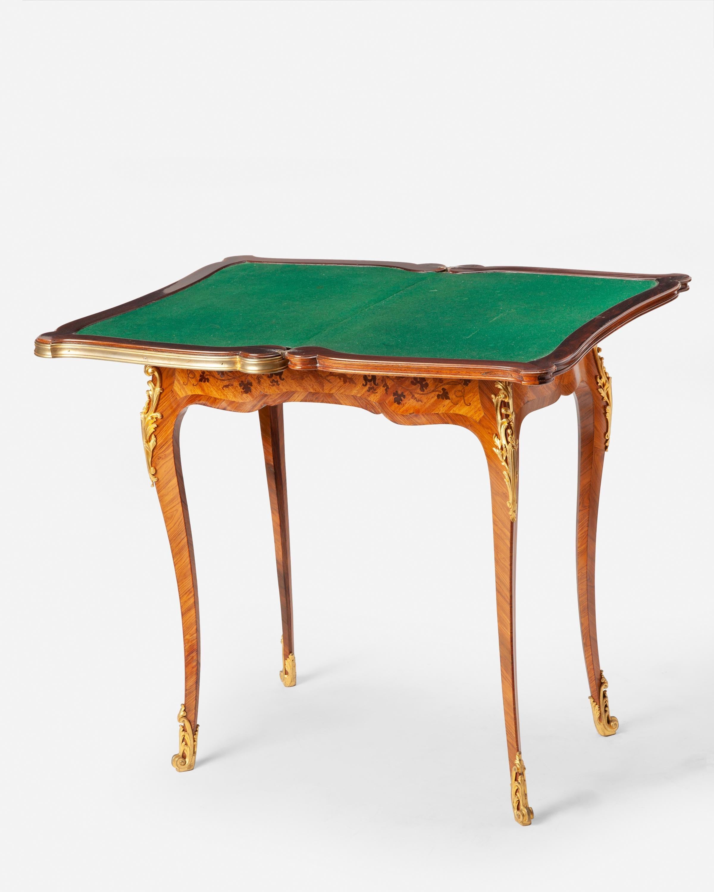 Fourth-quarter 19th century 
 Signed to one bronze mount: F. Linke 
 The flip-top game table with floral marquetry inlay, green felt interior surface, and gilt-bronze mounts raised on four cabriole legs with sabots to the feet 
 Open: 29.25