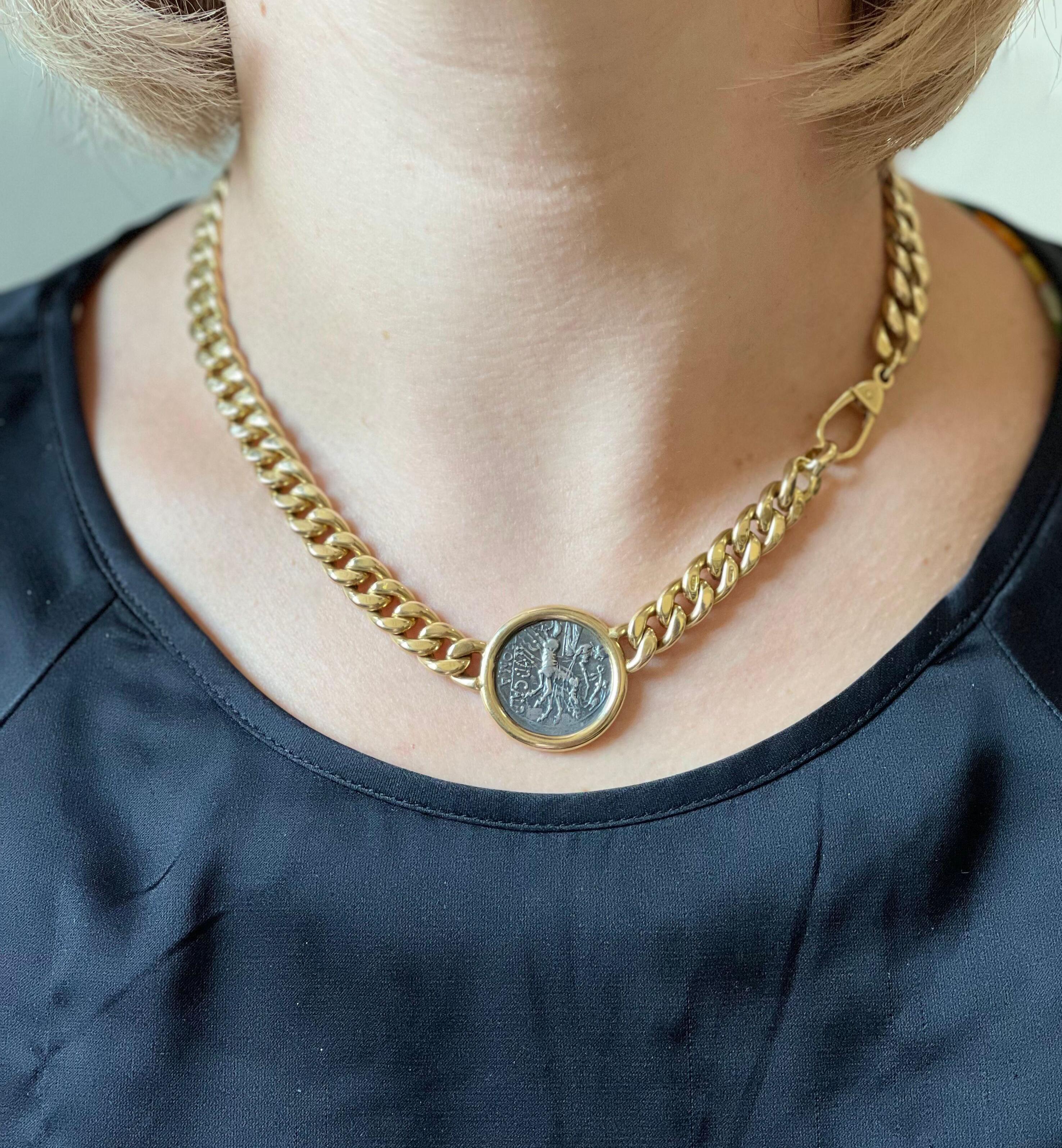 F. Moroni 18k gold curb link chain necklace, featuring bezel set ancient Roman empire coin in the center. Necklace is 17