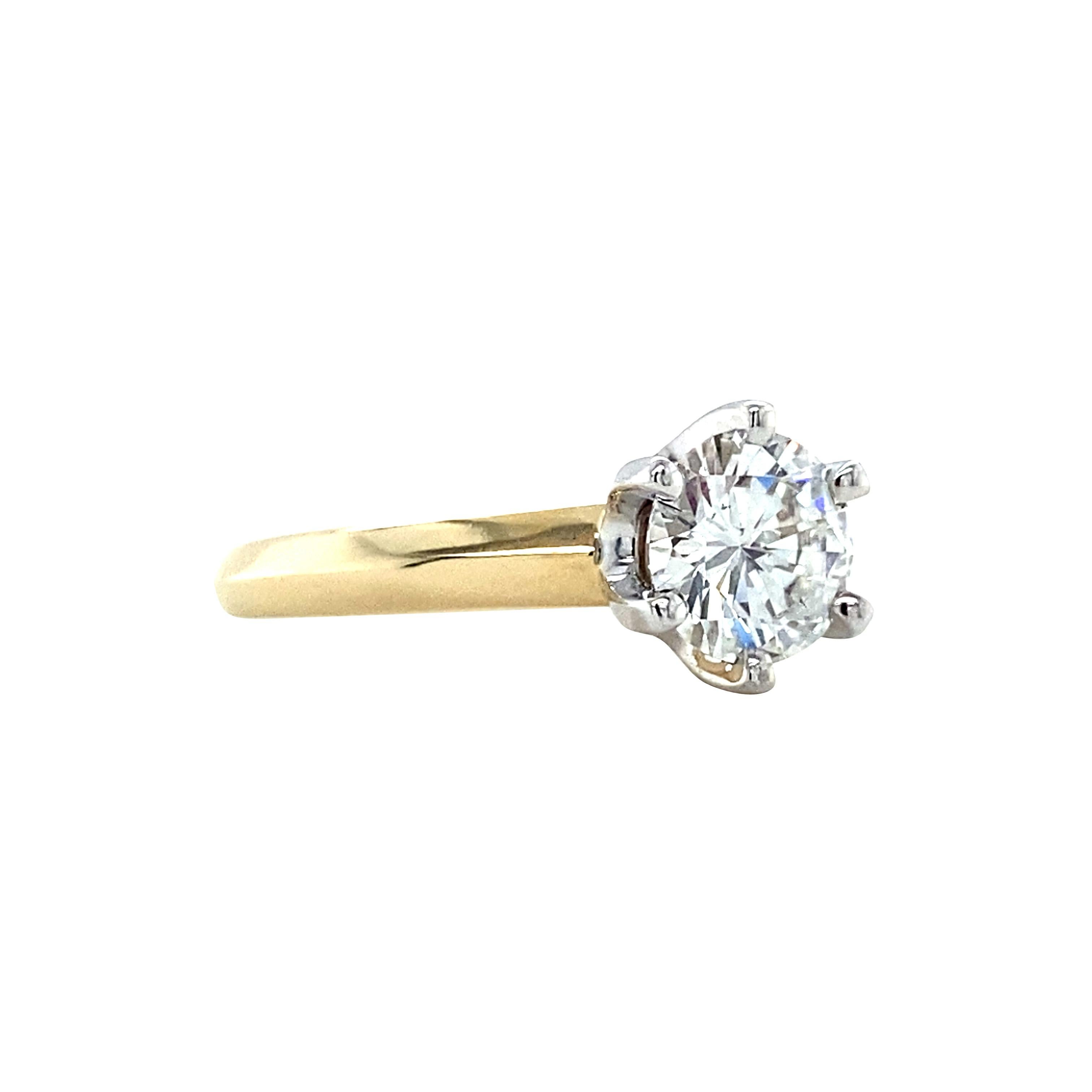 A brand new solitaire diamond ring, we created this ring by setting a vintage diamond into a new 14K solitaire mounting. The diamond is graded as F color, with a clarity grade of SI for slighty included. 

Bright white, this colorless diamond is