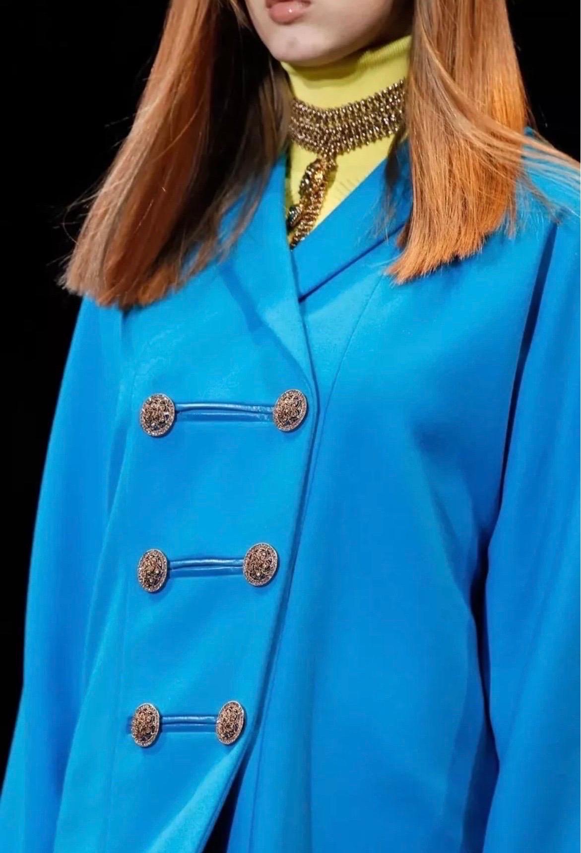 VERSACE
Actual runway sample F/W 2014 Look #14 
Caribbean Blue coat was actually worn by Lindsey Wixson during the show!  
Crystal embellished buttons 
A striking statement piece!
Content:  90% wool, 10% cashmere
lining:  100% silk and 100% leather