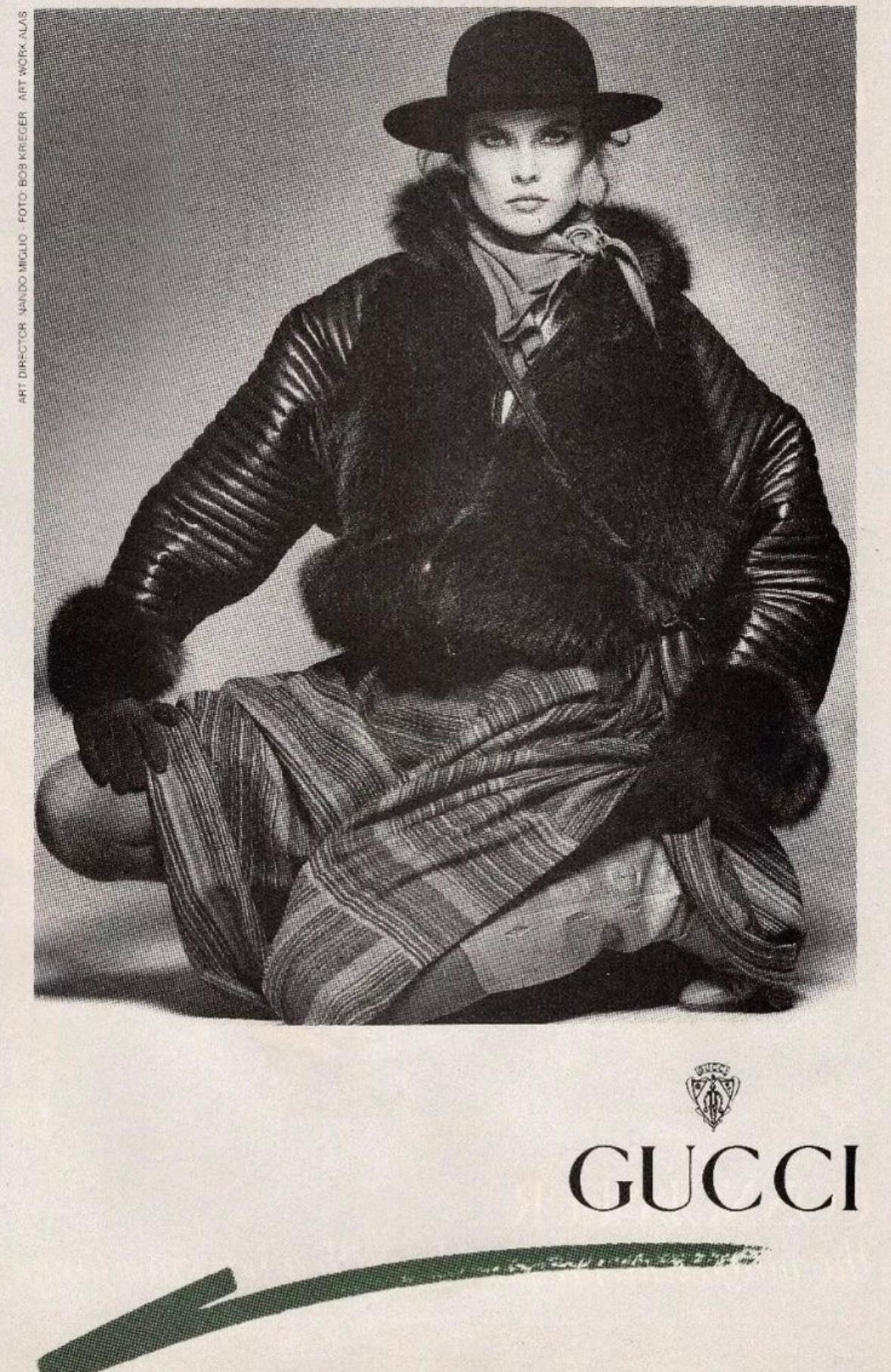 From the Fall/Winter 1983 collection, this fabulous brown Gucci jacket was constructed using brown leather and matching brown fox fur. The coat was captured in the season's ad campaign, modeled by Carol Alt and captured by Bob Krieger, and features