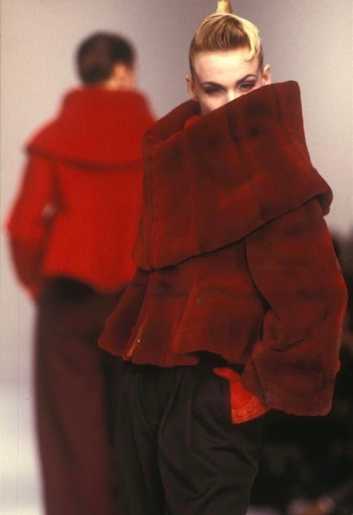 Presenting a stunning oversized red Claude Montana fur coat. From the Fall/Winter 1988 collection, this coat debuted on the season's runway and was also highlighted in the season's ad campaign in red wool. Exquisitely crafted, this remarkable coat