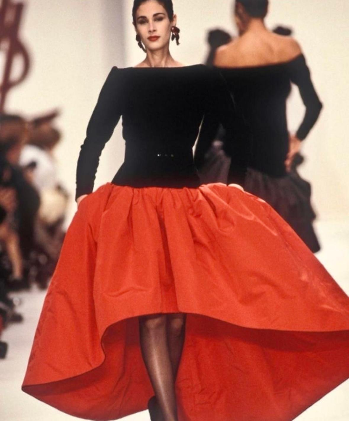 TheRealList presents: a fabulous black and red Saint Laurent Rive Gauche gown, designed by Yves Saint Laurent. From the Fall/Winter 1988 collection, this incredible dress debuted on the season's runway and was also highlighted in the season's ad