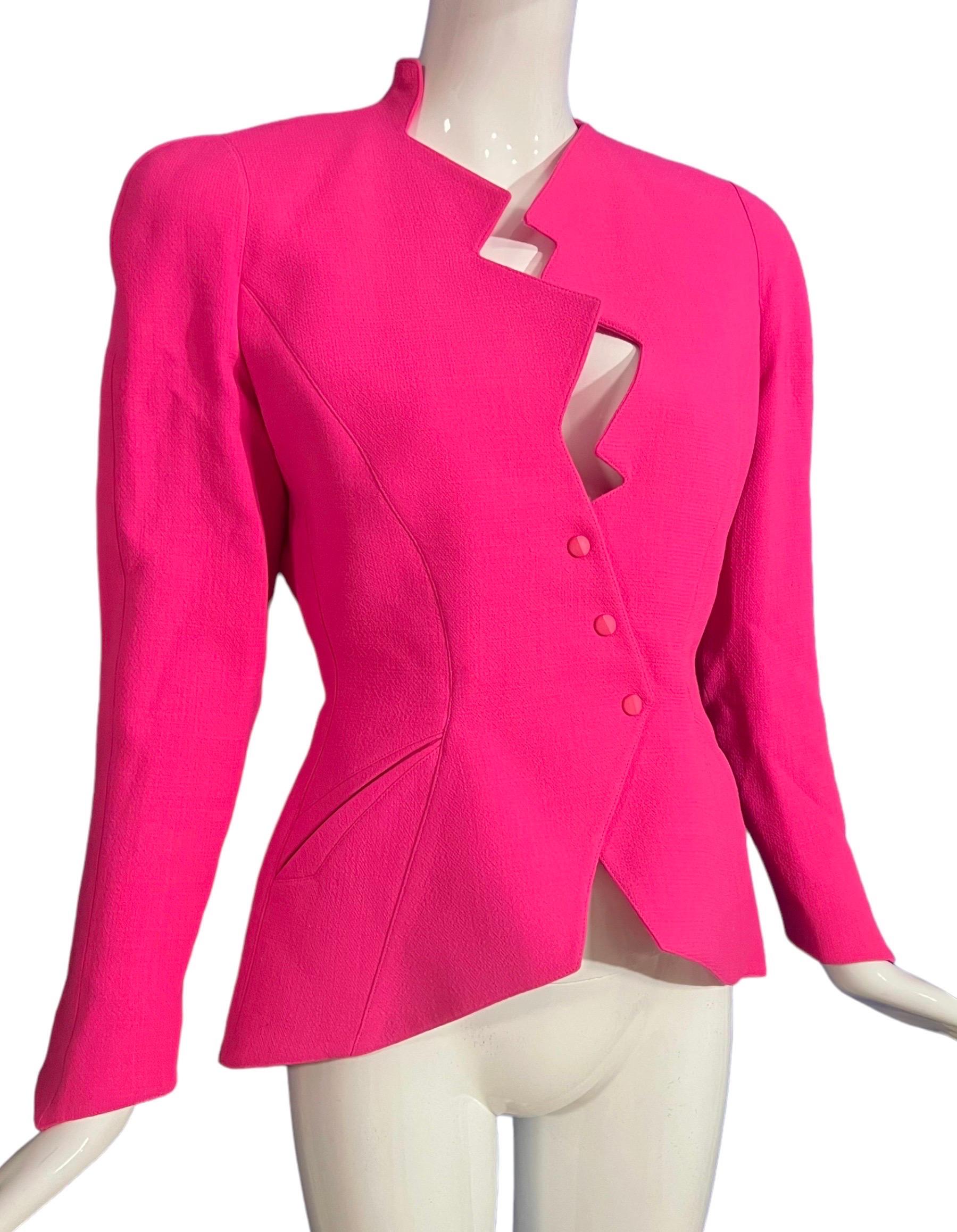 Thierry Mugler documented vibrant hot pink zig zag lightning bolt jacket from the Fall Winter “Les Infernales” 1988 collection and seen on the runway. As famously seen on Samantha Jones played by Kim Cattrall in Sex and the City. 
Zigzag cut neck,