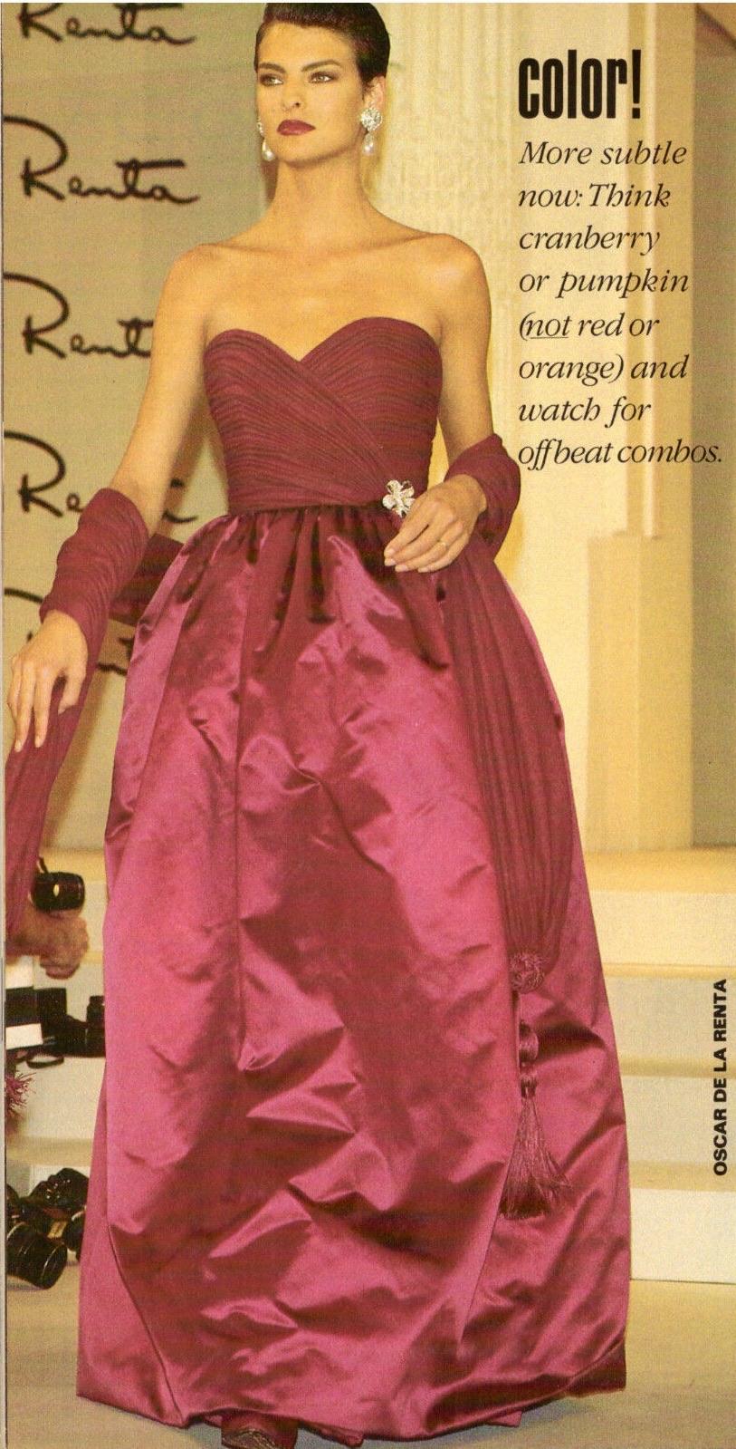 Presenting a fabulous cranberry Oscar de la Renta gown. From the Fall/Winter 1989 collection, this incredible floor length dress debuted on the season's runway modeled by Linda Evangelista. Featuring a full silk satin skirt this strapless gown is