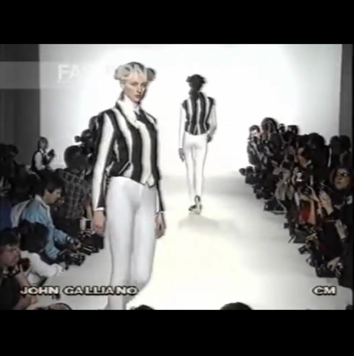 Presenting a fabulous black and white striped John Galliano London jacket. From the Fall/Winter 1990 'Fencing' collection, this beautiful jacket debuted on the season's runway. A fabulous example of Galliano's masterful tailoring and design, this