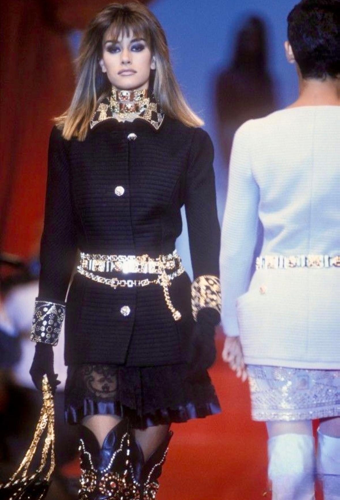 Introducing a stunning black quilted wool jacket from Atelier Versace, designed by Gianni Versace for the Fall/Winter 1991 Haute Couture collection. This beautifully crafted, custom handmade jacket made its debut on the season's runway, modeled by