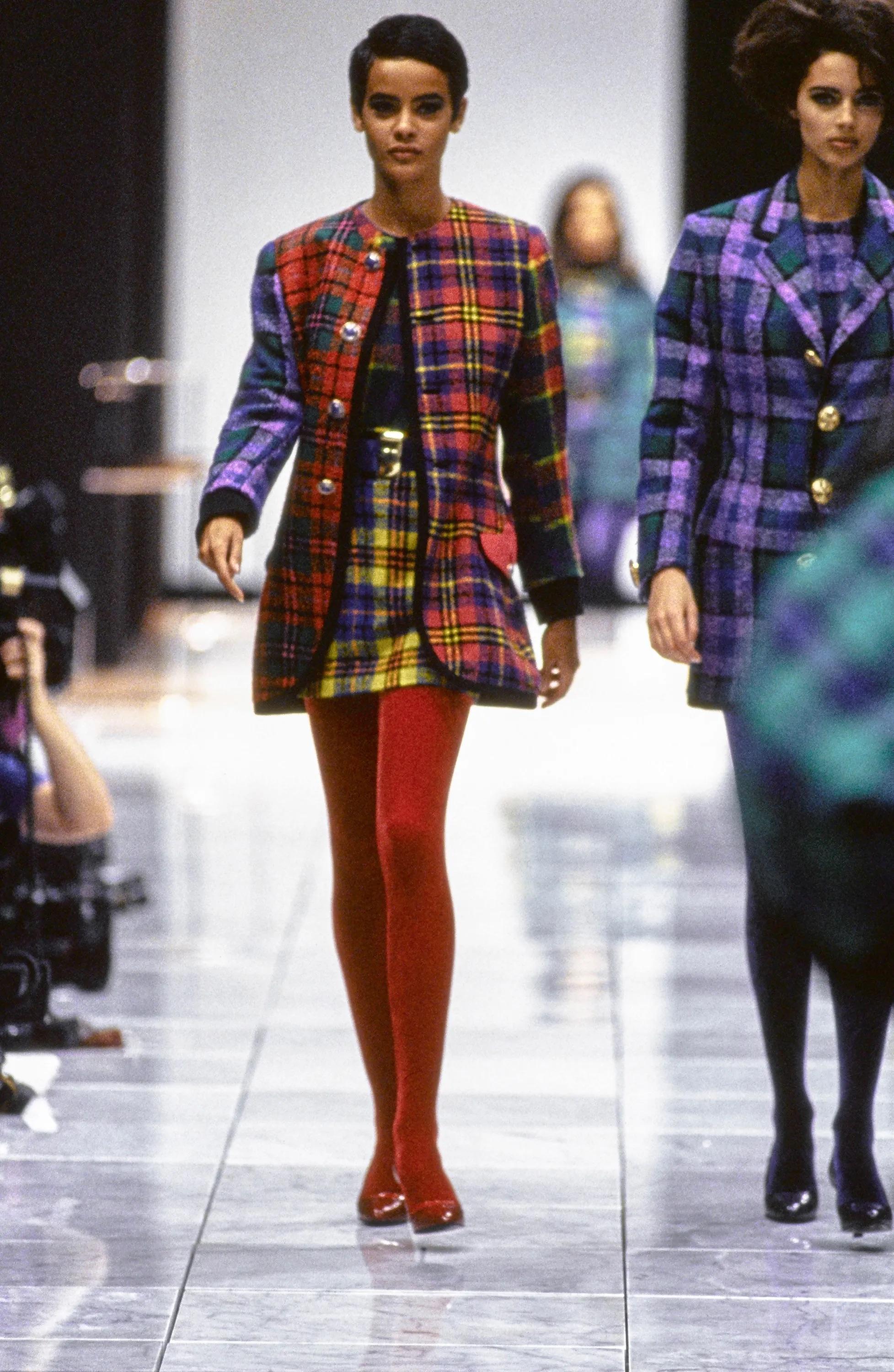 Presenting a beautiful purple and green plaid Gianni Versace tweed blazer dress, designed by Gianni Versace. From the Fall/Winter 1991 collection, this long jacket debuted on the season's runway and showcases the brand's dedication to impeccable
