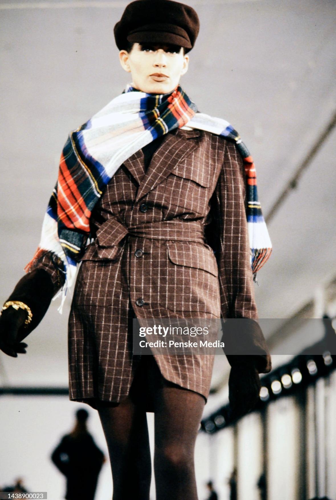 Presenting a fabulous brown window pane Issac Mizrahi blazer mini dress. From the Fall/Winter 1991 collection, this suiting-inspired coat / mini dress debuted on the season's runway and features elements of a classic men's suit. This chic piece