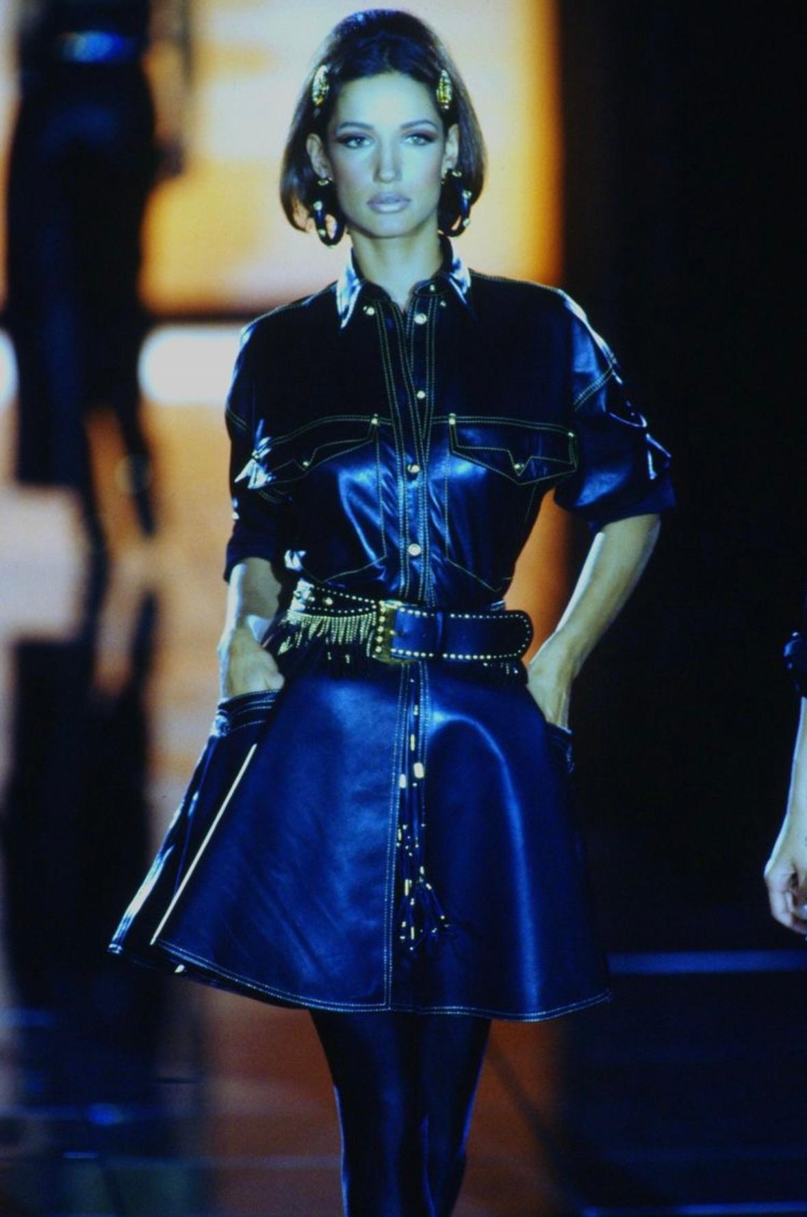 TheRealList presents: a fabulous black leather Gianni Versace belt, designed by Gianni Versace. From the Fall/Winter 1992 ‘Miss S&M’ collection, this wide belt debuted on the season's runway as part of look 39 modeled by Marpessa Hennink. The belt
