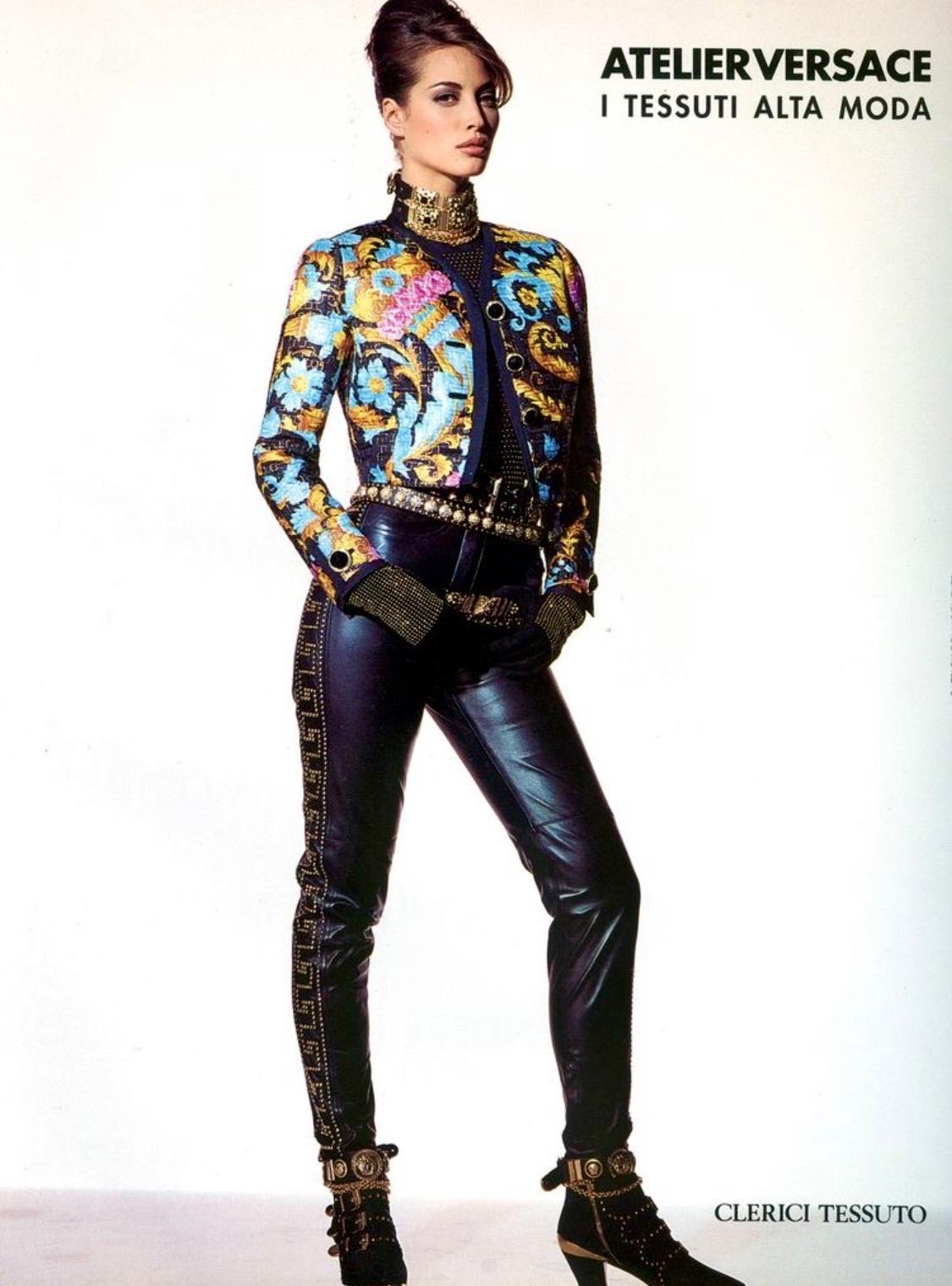 Presenting the studded Versace pants of your dreams, designed by Gianni Versace. These pants are from the F/W 1992 'Miss S&M' collection, commonly known as the 'bondage' collection. The leather version of these pants debuted in the Fall/Winter 1991