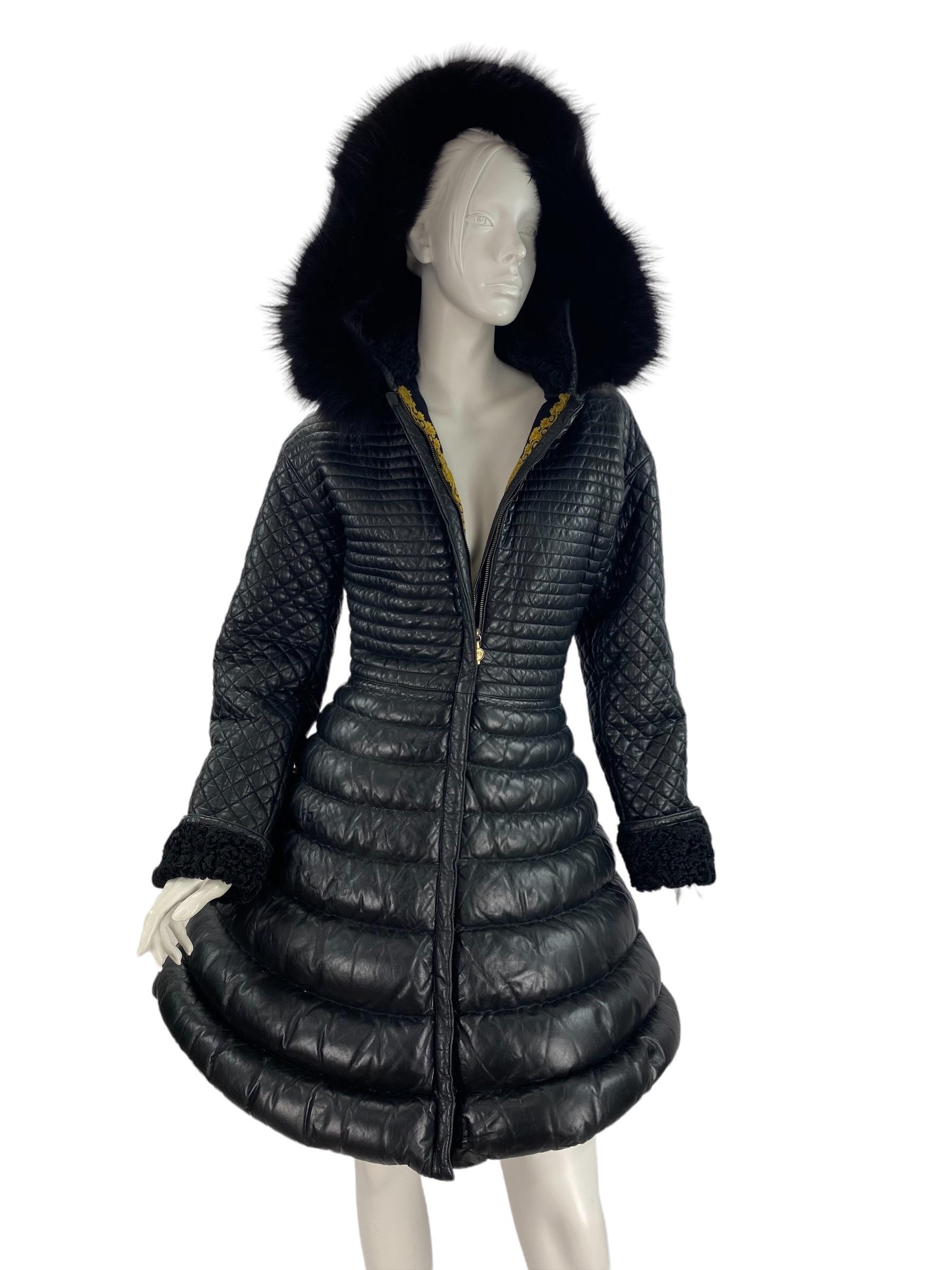 F/W 1992 Rare Vintage Gianni Versace Leather Bondage Black Leather Coat - Museum grade!
Approximate size is 4
Quilted leather, Down filling, Removable hood with Fox fur, Barocco print lining, Front zipper closure.
Measurements: Bust - 36 inches,