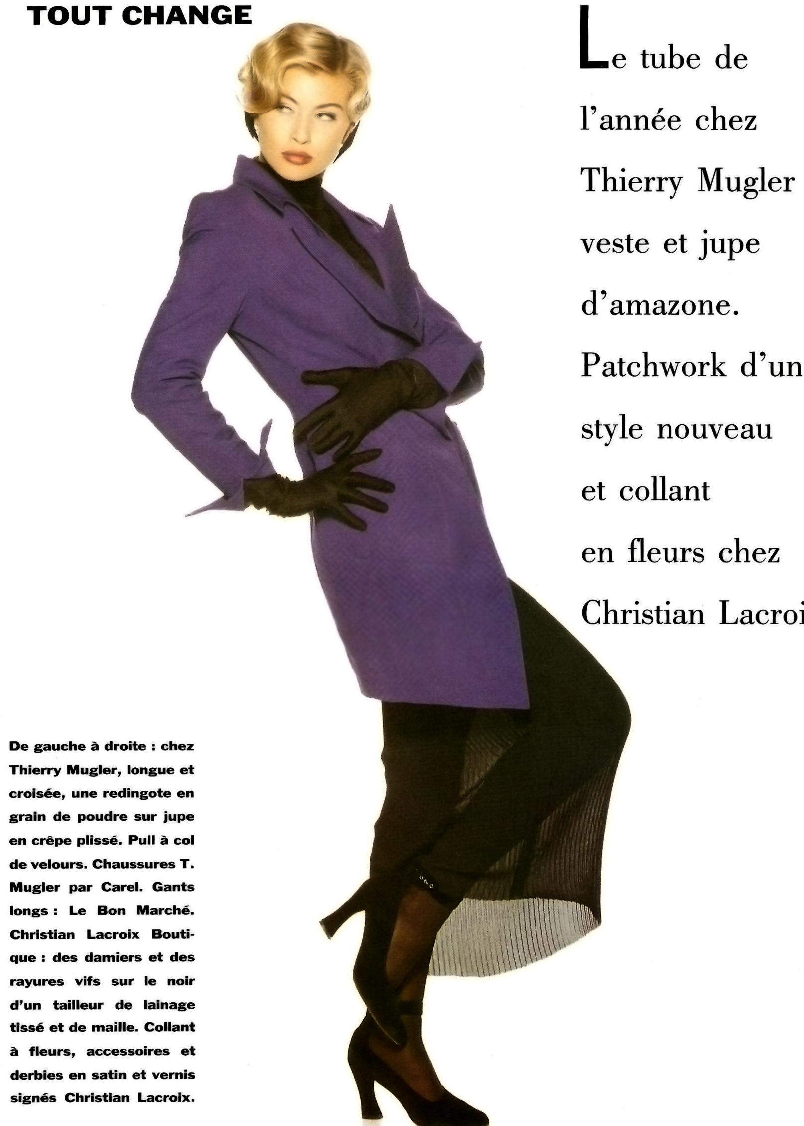 From Thierry Mugler’s Fall/Winter 1992 collection, this grey wool coat dress features sculpted paneling and a sharply tailored silhouette. The design includes exaggerated lapels, structured shoulders, and signature Mugler seaming for a dramatic,