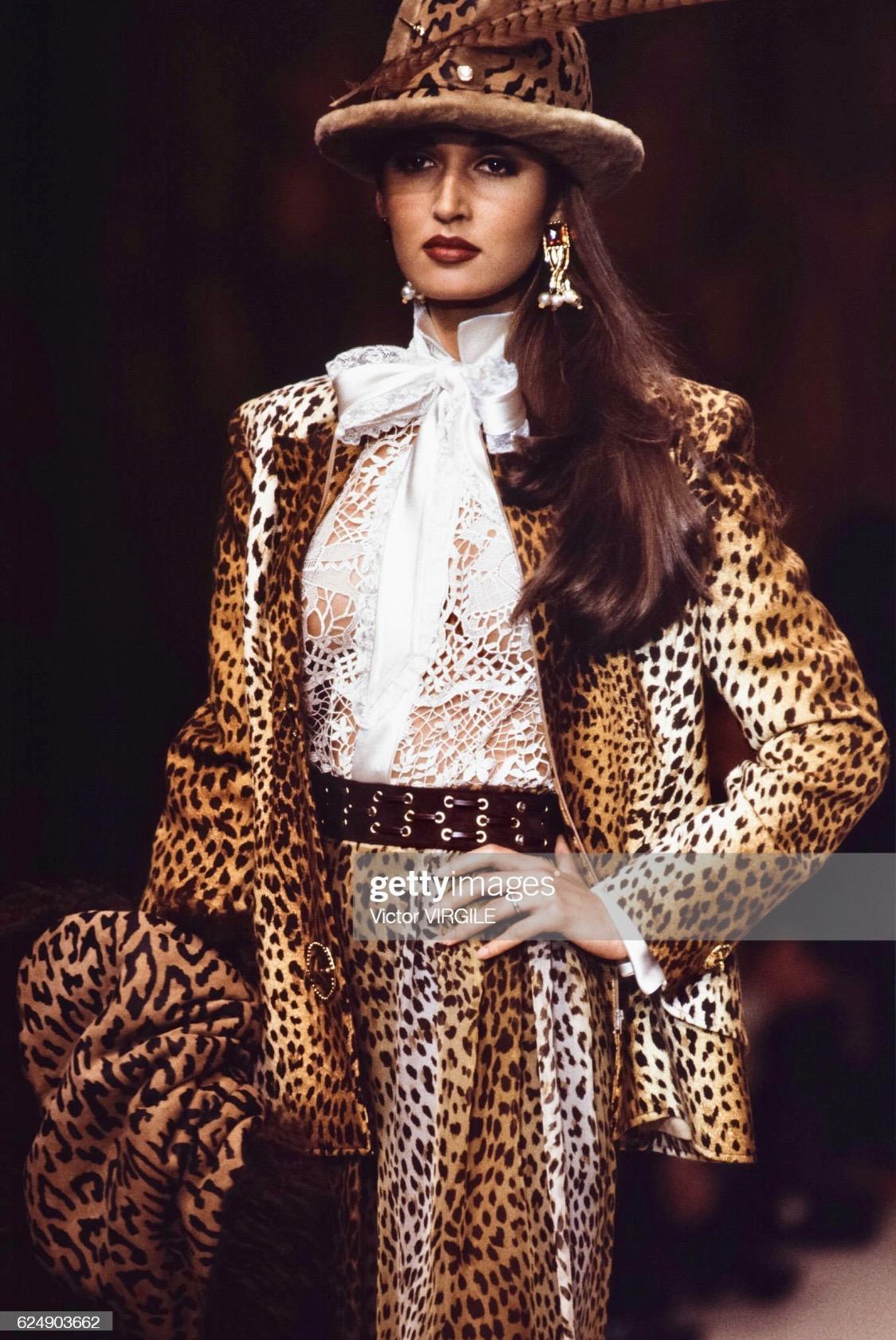 Presenting a fabulous cheetah print Valentino Boutique blazer. From the Fall/Winter 1992 collection, this stunning jacket debuted on the season's runway and is covered in cheetah print felt fabric. The blazer is made complete with gold-tone brooches