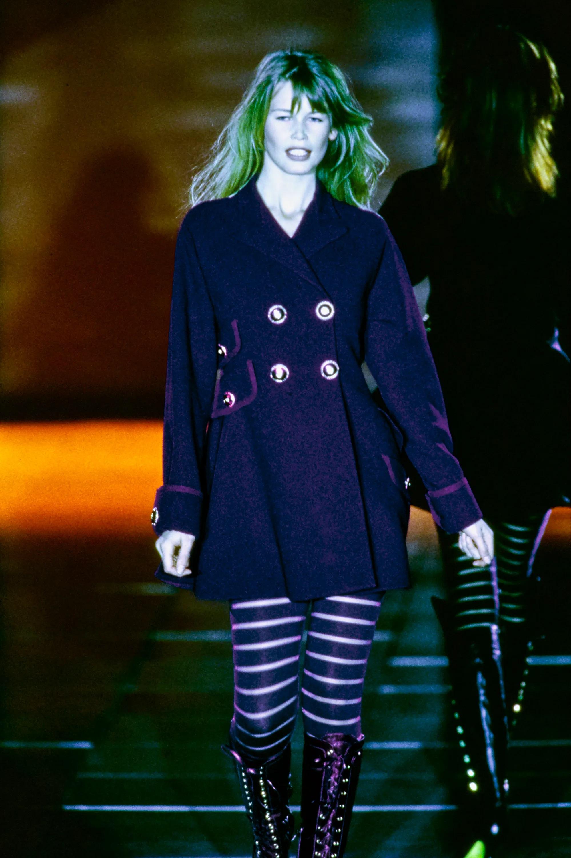 Presenting a pair of of purple Gianni Versace footed leggings, designed by Gianni Versace. From the Fall/Winter 1993 collection, these striped leggings debuted on the season's runway as part of look 34, modeled by Claudia Schiffer. These