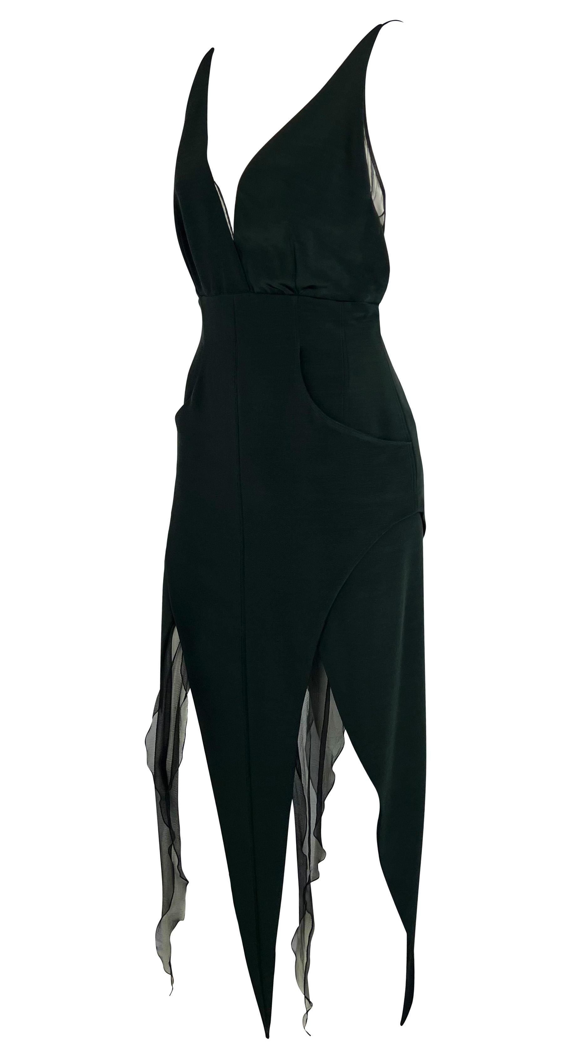 This incredible deep green dress by Karl Lagerfeld is from the Fall/Winter 1993 collection and features an intricate skirt design featured heavily on the season's runway. This ultra-sexy dress features a deep V-neckline, an exposed back, and a