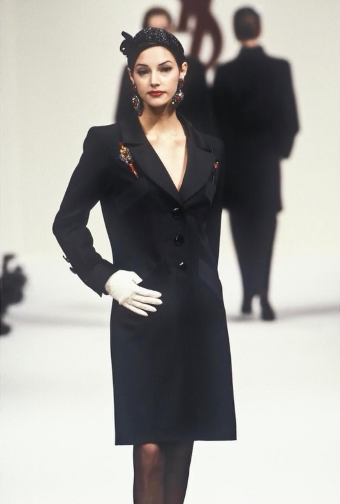 Presenting a fabulous Yves Saint Laurent Rive Gauche blazer dress. From the Fall/Winter 1993 collection, this dress debuted on the season's runway. This chic dress features a fold-over collar, button-down closure, and pockets at the bust/hips. The