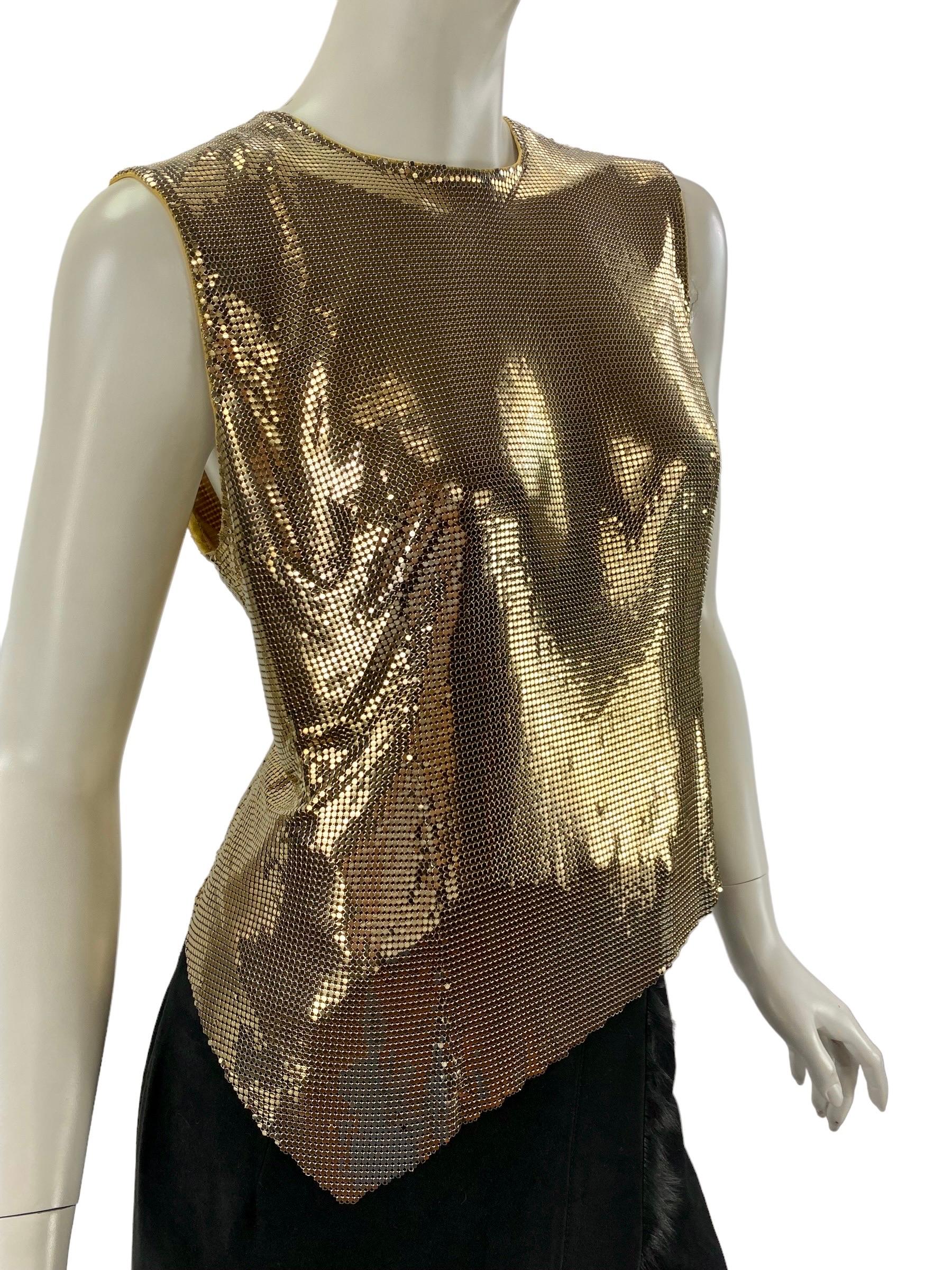 F/W 1994 Gianni Versace Couture Gold Metal Mesh Oroton Top
Size: Italian - 40, US - 4
Zipper on the back, Fully lined.
Measurements: length - 18 inches ( highest part ), 22