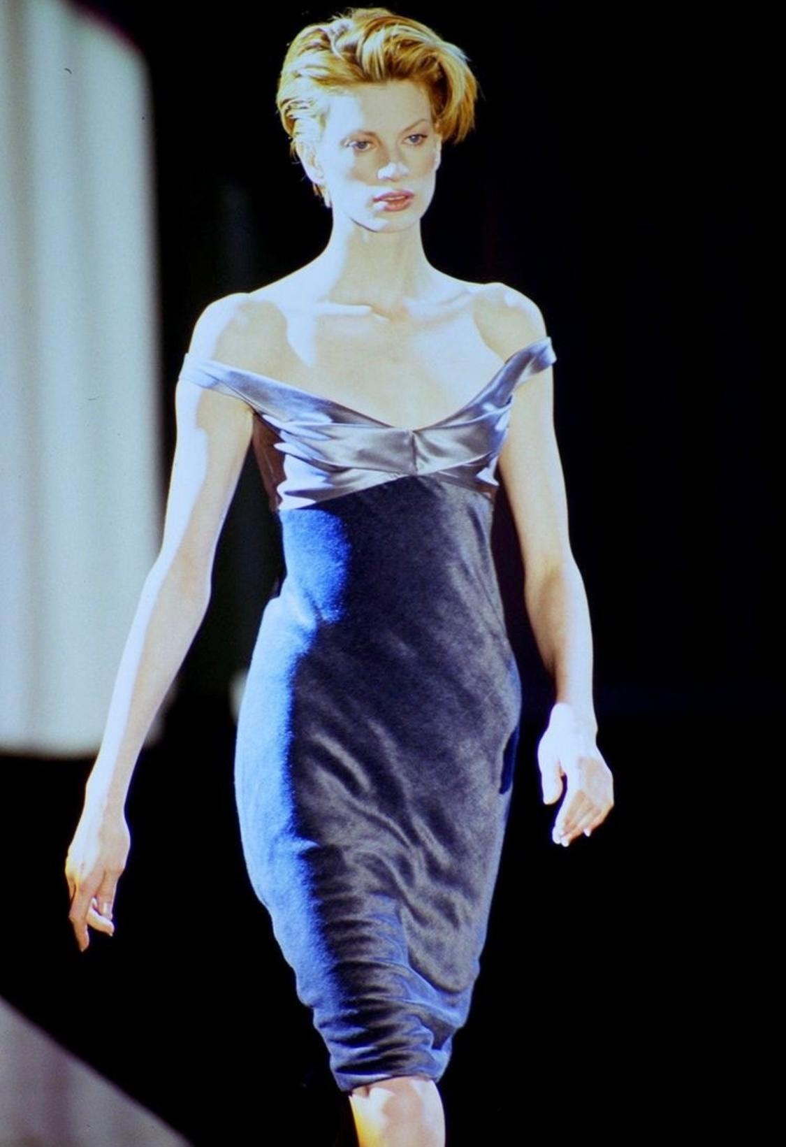 Presenting a lustrous satin and velvet Gianni Versace Couture dress, designed by Gianni Versace. From the Fall/Winter 1995 collection, the dress debuted on the season's runway as look number 56 on Kristen McMenamy. The dress is constructed of grey