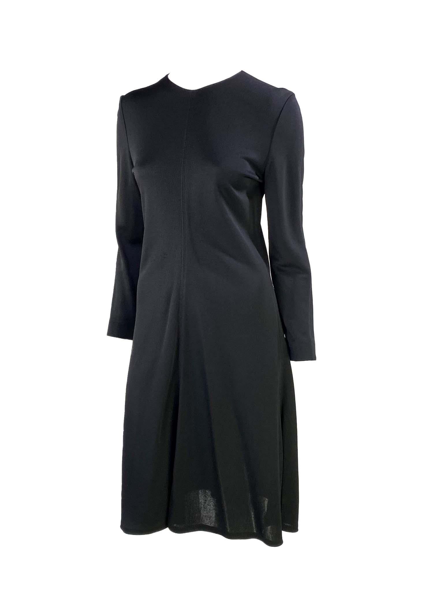 Presenting a little black Gucci dress, designed by Tom Ford. From the Fall/Winter 1995 collection, this simple and elegant long sleeve midi dress is constructed of viscose and features an a-line skirt shape. From one of Ford's earliest collections,
