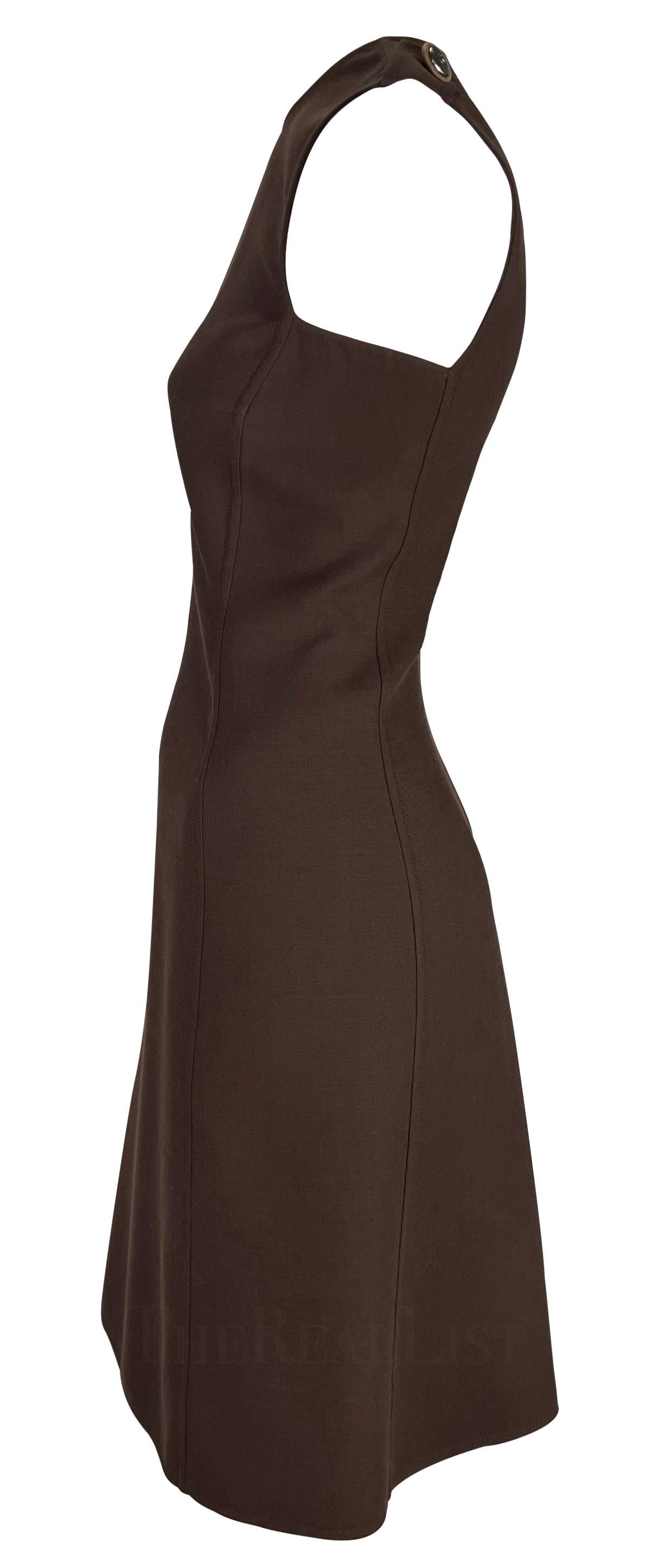Presenting a fabulous brown Gianni Versace shift dress, designed by Gianni Versace. From the Fall/Winter 1996 collection, this dress features a high neckline and is made complete with epaulets at either shoulder with a silver-tone Versace Medusa