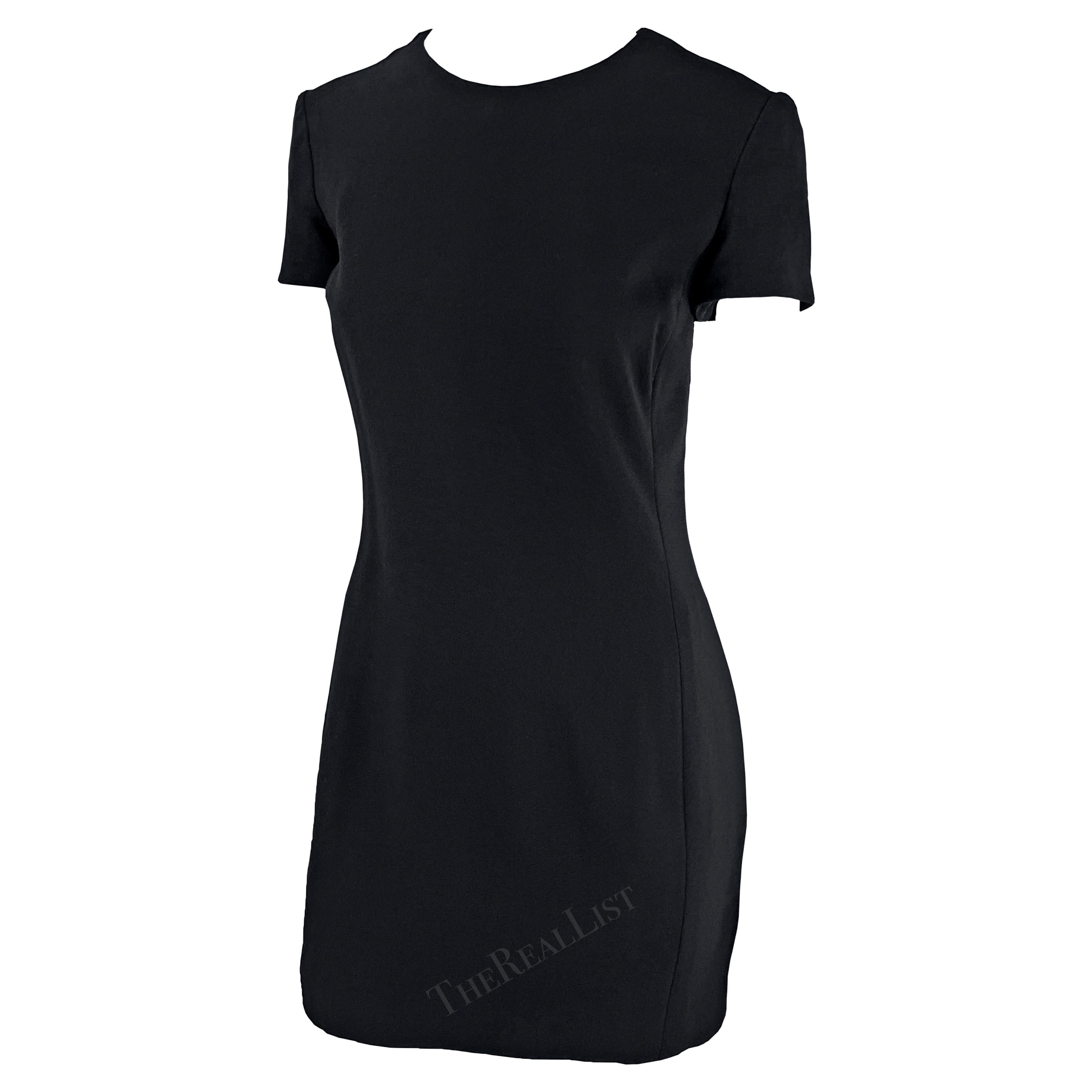 Presenting the perfect Gianni Versace little black dress, designed by Gianni Versace. From the Fall/Winter 1996 collection, this perfectly fitted mini dress features a tapered cut, short sleeves, and a crew neckline. Effortlessly chic and timeless,