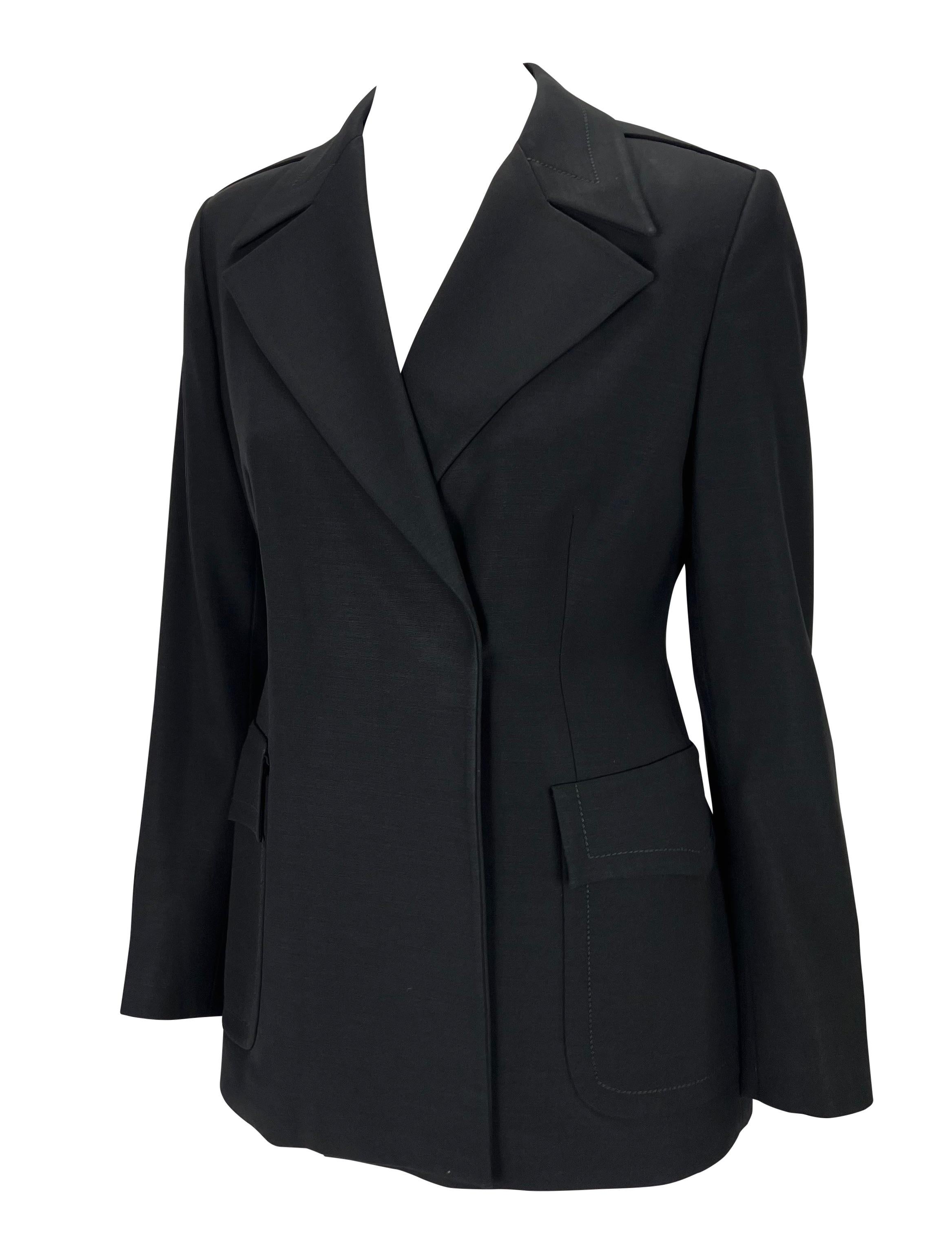 TheRealList presents: a fabulous navy wool Gucci jacket, designed by Tom Ford. From the Fall/Winter 1996 collection, this jacket features a wide lapel, dramatic pockets at the front, and epaulets. 

Follow us on Instagram!