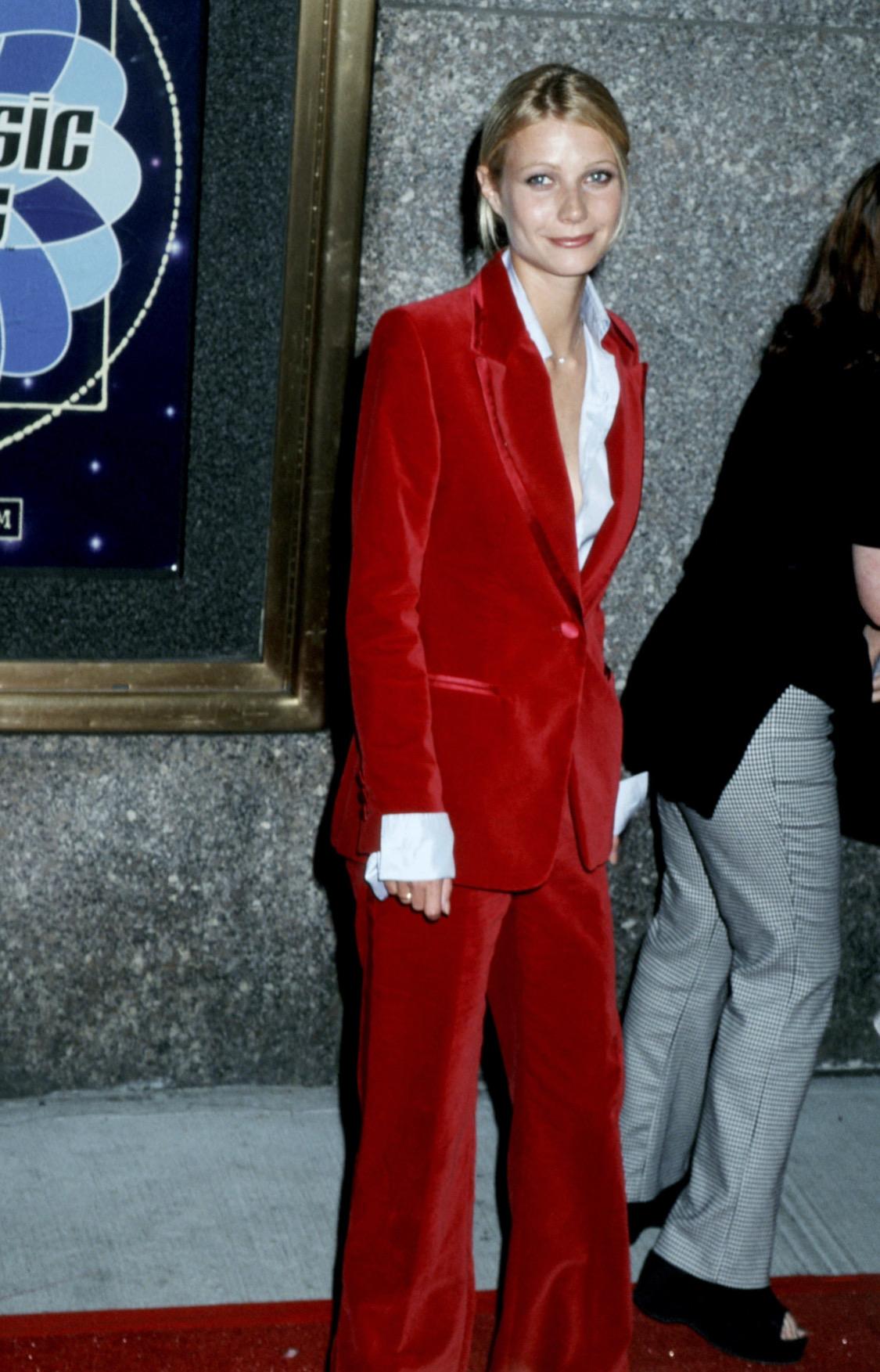 TheRealList presents: the Tom Ford for Gucci red velvet suit. One of Ford's most, if not the most, iconic designs is this red velvet pant suit which debuted on the Fall/Winter 1996 runway as look 39 modeled by Trish Goff. This suit was famously worn
