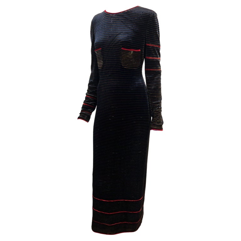 TheRealList presents: a striped navy and red velvet Chanel maxi dress, designed by Karl Lagerfeld. From the Fall/Winter 1997 collection, this stretchy long sleeve dress is constructed entirely of brown and navy stripes with a few red accent stripes.