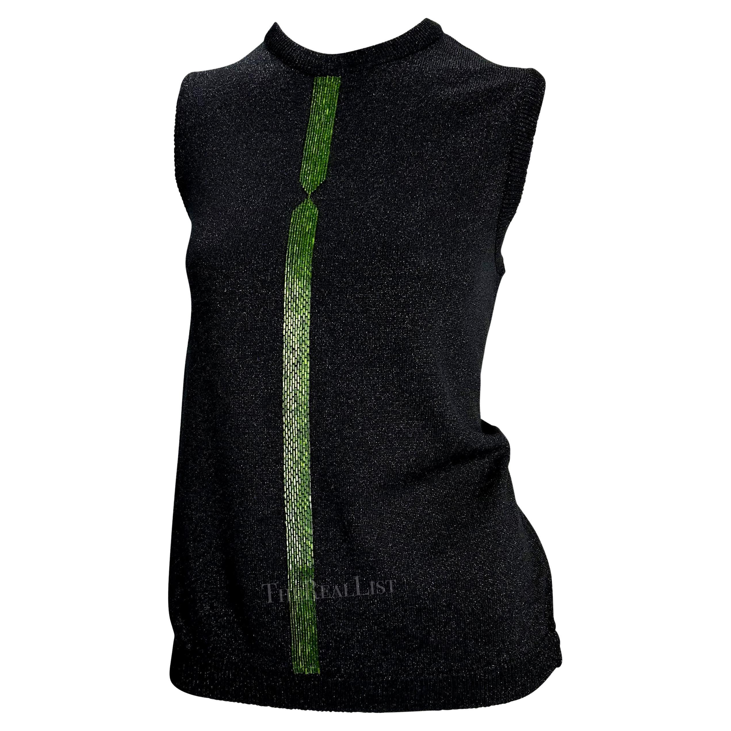 Presenting a fabulous dark grey Gianni Versace beaded sweater vest, designed by Donatella Versace. From the Fall/Winter 1997 collection, this knit sweater features a vibrant green beaded accent down the front of the top. Add this rare piece of