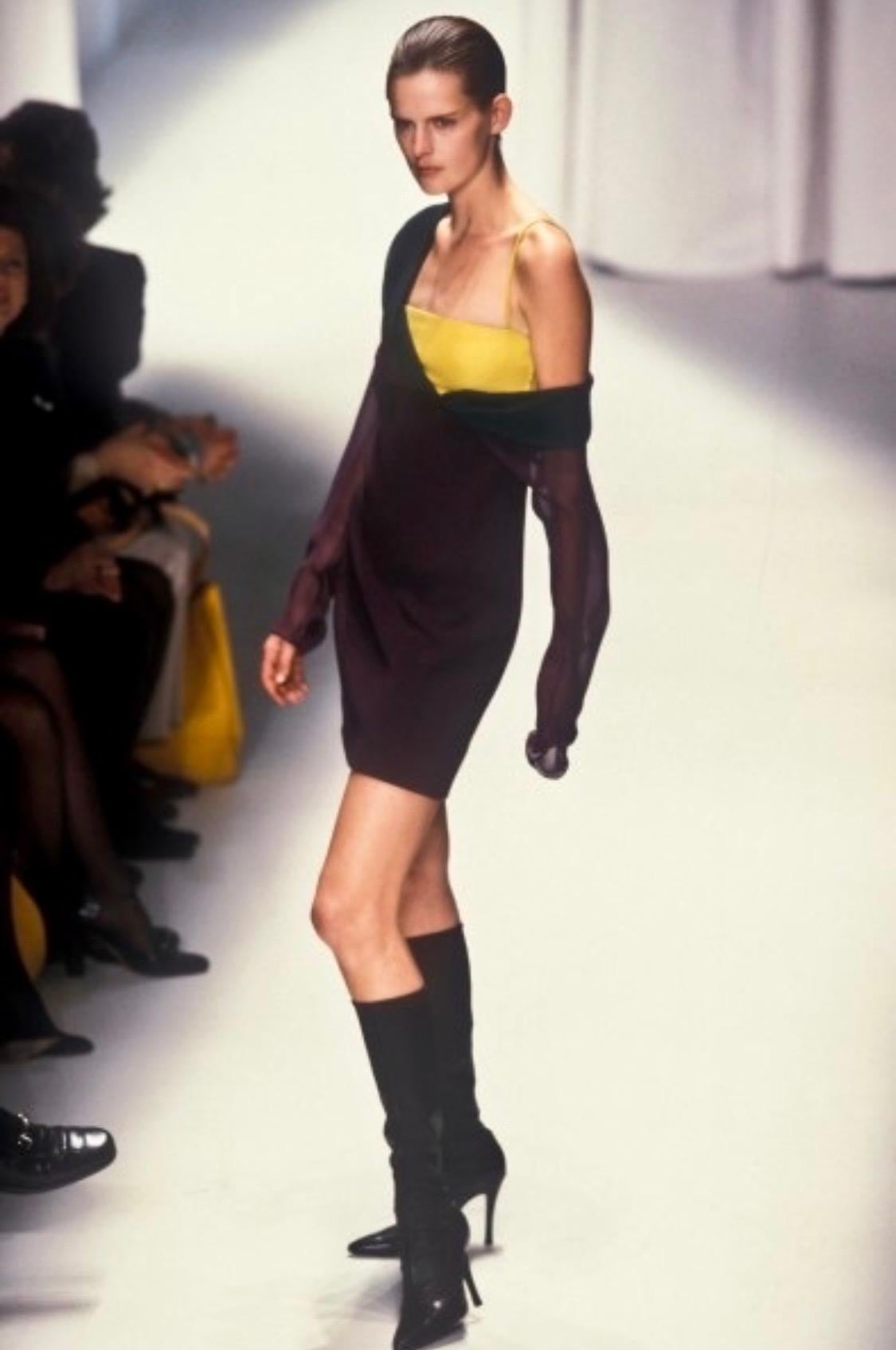 Presenting a unique Gianni Versace Couture color block dress, designed by Gianni Versace. From the Fall/Winter 1997 collection, this dress debuted on the season's runway and was modeled by Stella Tennant.  This aubergine-colored dress features a